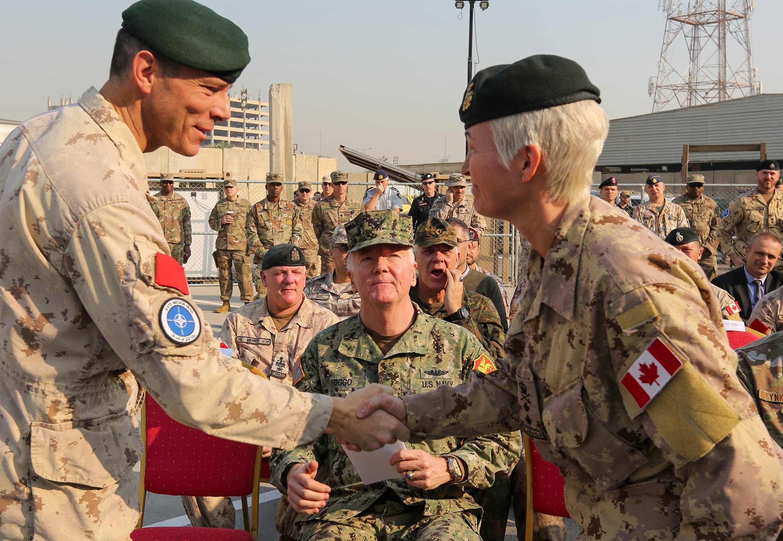 Canadian Maj.-Gen. Jennie Carignan (R) accepts command of NATO's Iraq mission from outgoing commander Dany Fortin during a handover ceremony in Baghdad in November. (Sabah Arar/ AFP/Getty Images)