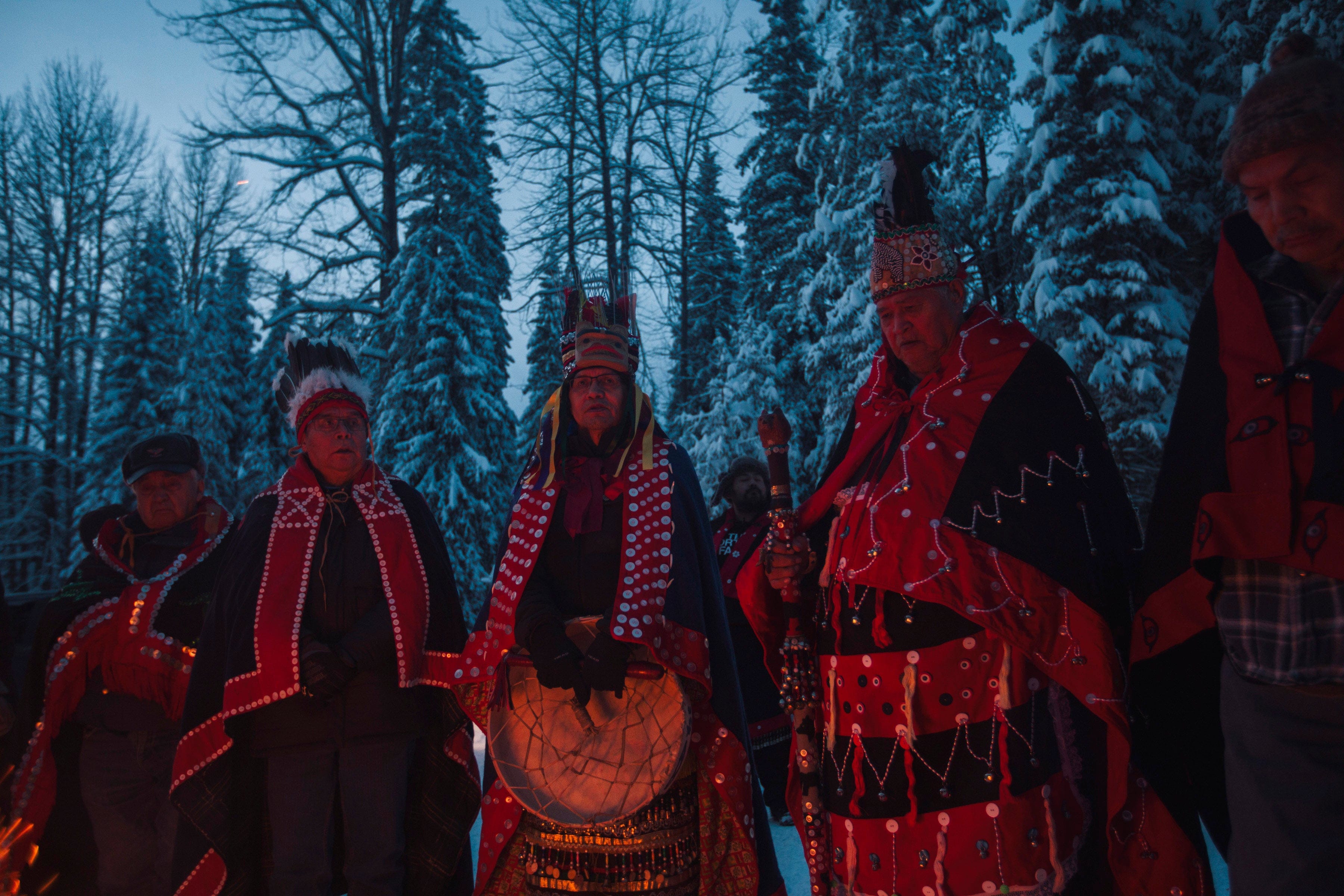 Wet’suwet’en territory near Houston. The chiefs gathered together to show a unified collective agreement to serve the eviction to CGL. Gathered at the fire they each spoke to the wishes of their respective clan. Many spoke of the Wetsuweten law and the need for free prior and informed consent for projects in their yintah (territory). They also shared songs and conversation while everyone waited for the eviction notice to be served. Someone shared some pepperoni and chips with everyone. Eventually the notice was served and we heard the workers were going to leave, the chiefs waited for the trucks of cgl employees to leave before heading home. Saturday, January 4, 2020. (Amber Bracken)