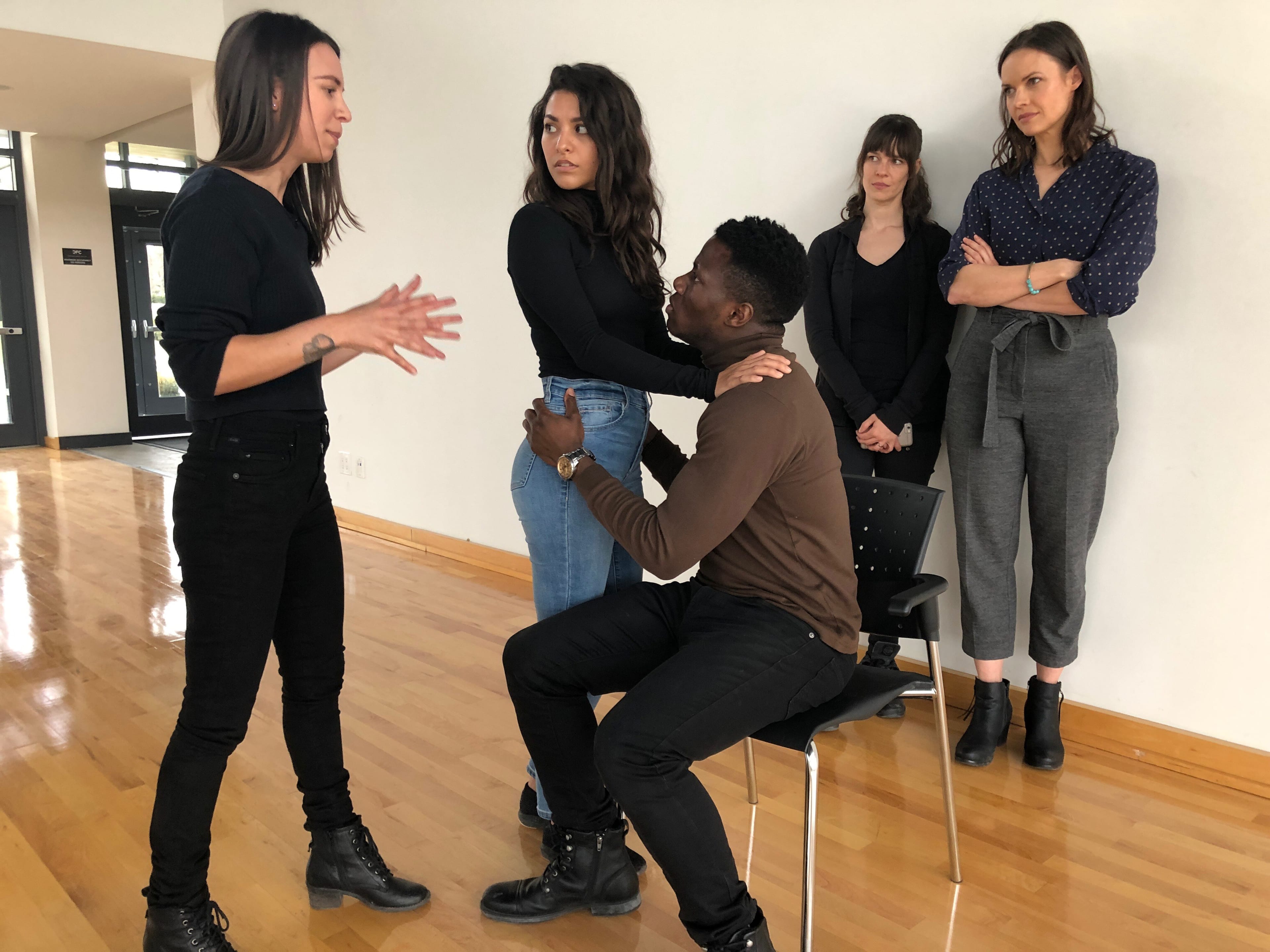 Lindsay Somers, left, works with actors while Casey Hudecki, second from right, and actor, director and producer Liz Whitmere look on in the background. (Alice Hopton/CBC)