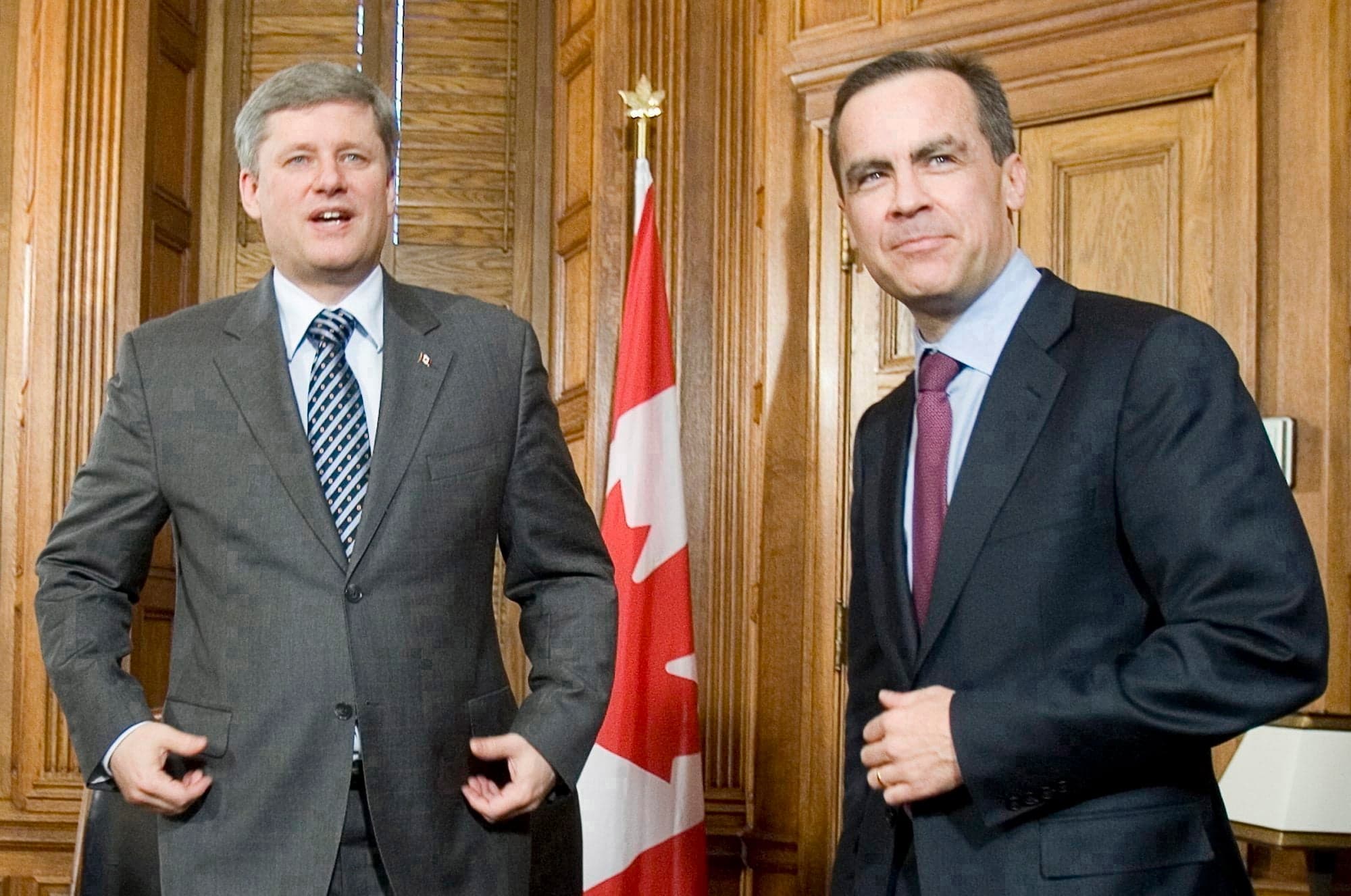 Incoming Bank of Canada governor Mark Carney (right) and Prime Minister Stephen Harper pose prior to the start of their meeting on Parliament hill in Ottawa Thursday, Jan. 31, 2008. (Tom Hanson/CP)