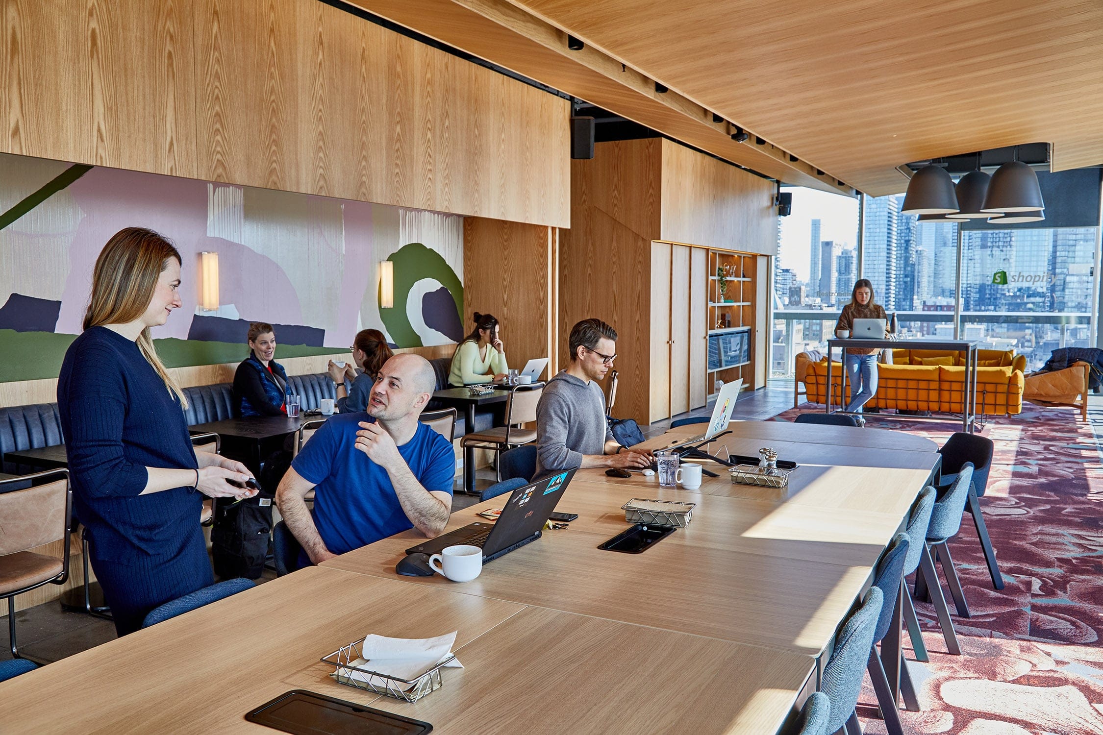 Shopify's Second Toronto Office (620 King Street West ) - Shopify employees working in the 14th floor lounge. (Photograph by Christie Vuong)
