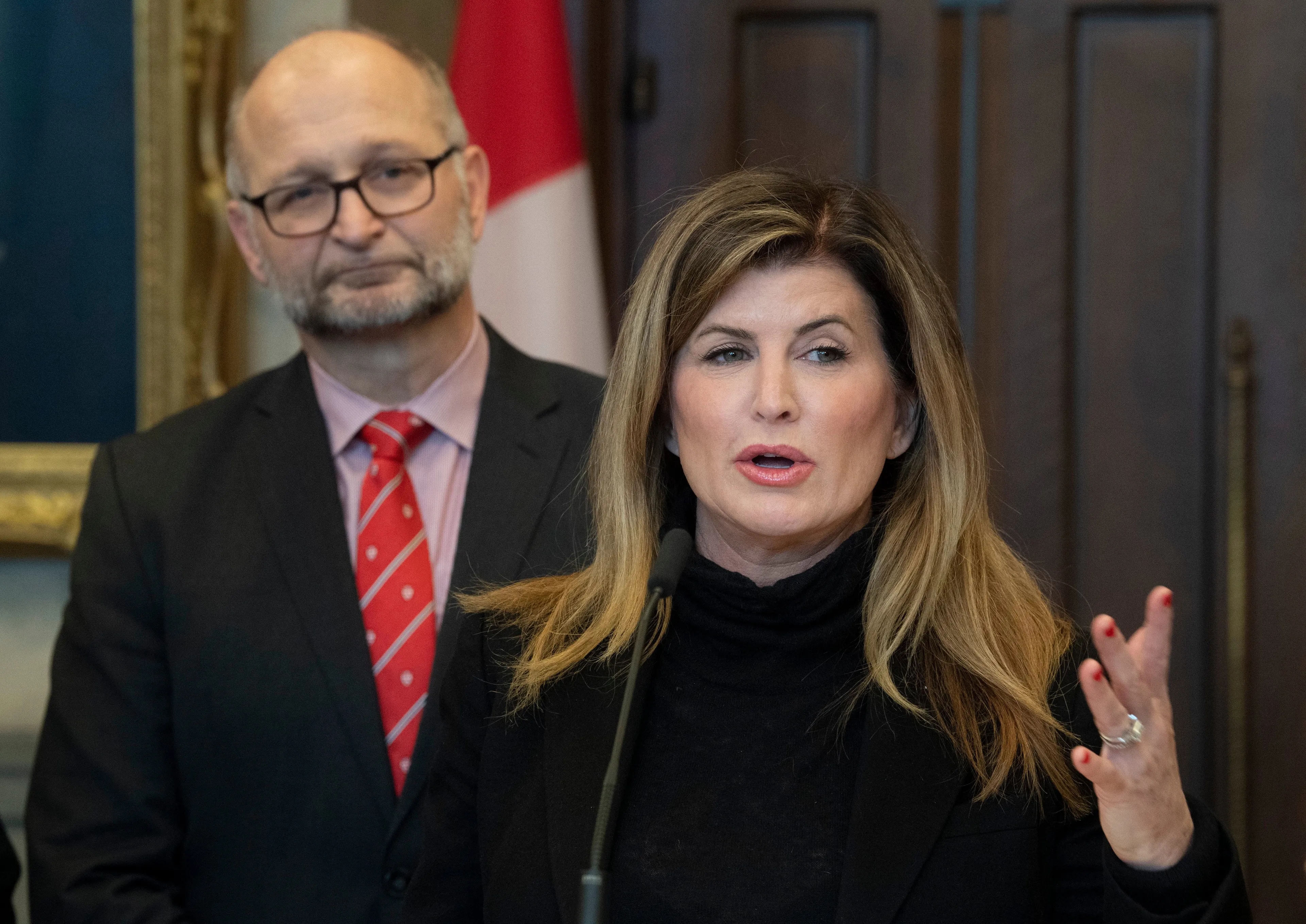Minister of Justice and Attorney General of Canada David Lametti looks on as Rona Ambrose speaks about a government bill on Feb. 4, 2020 on Parliament Hill in Ottawa. (Adrian Wyld/CP)