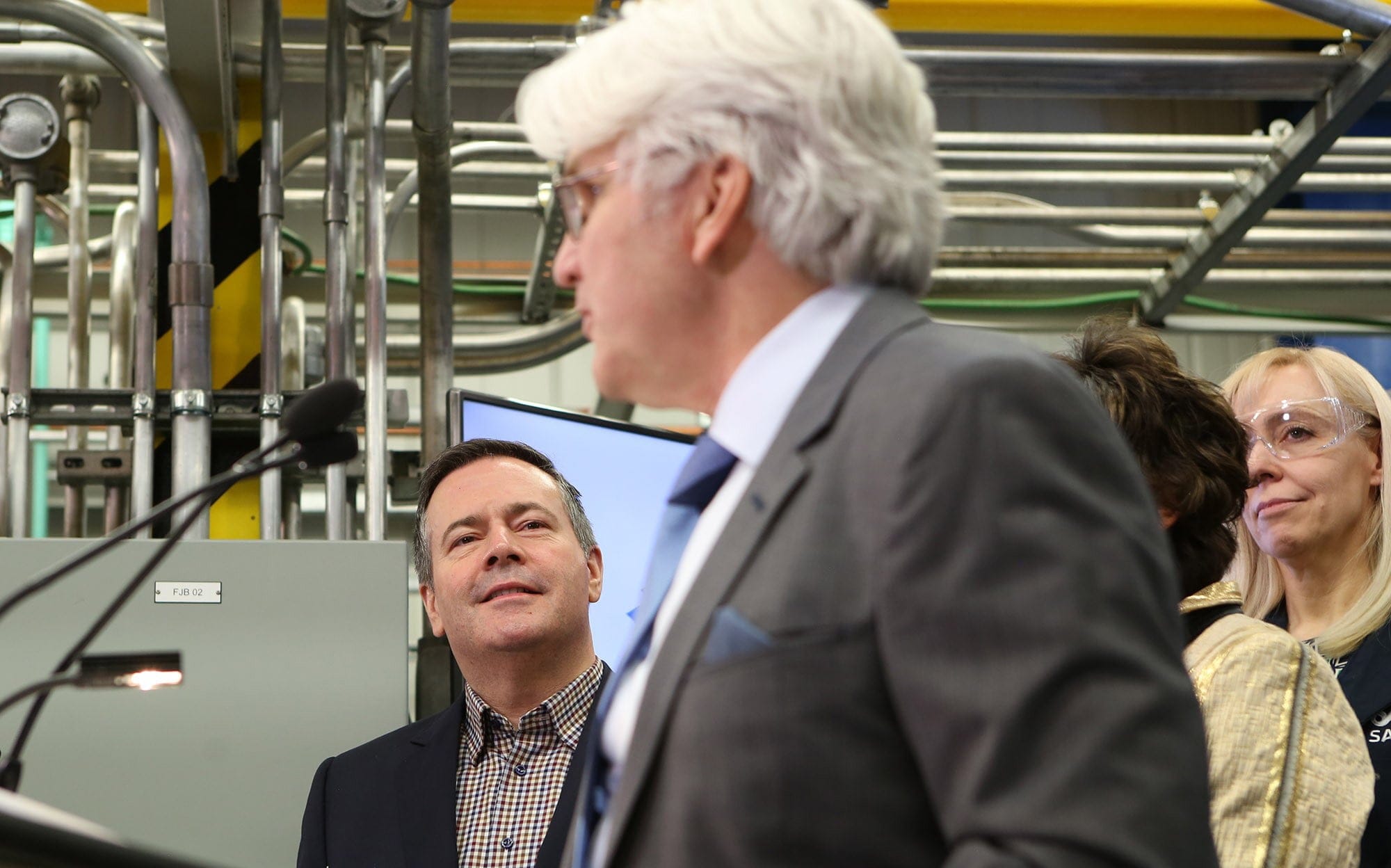 Kenney looks on as Tom Olsen, head of the Canadian Energy Centre, addresses a press conference last fall at the Southern Alberta Institute of Technology (Greg Fulmes/CP)