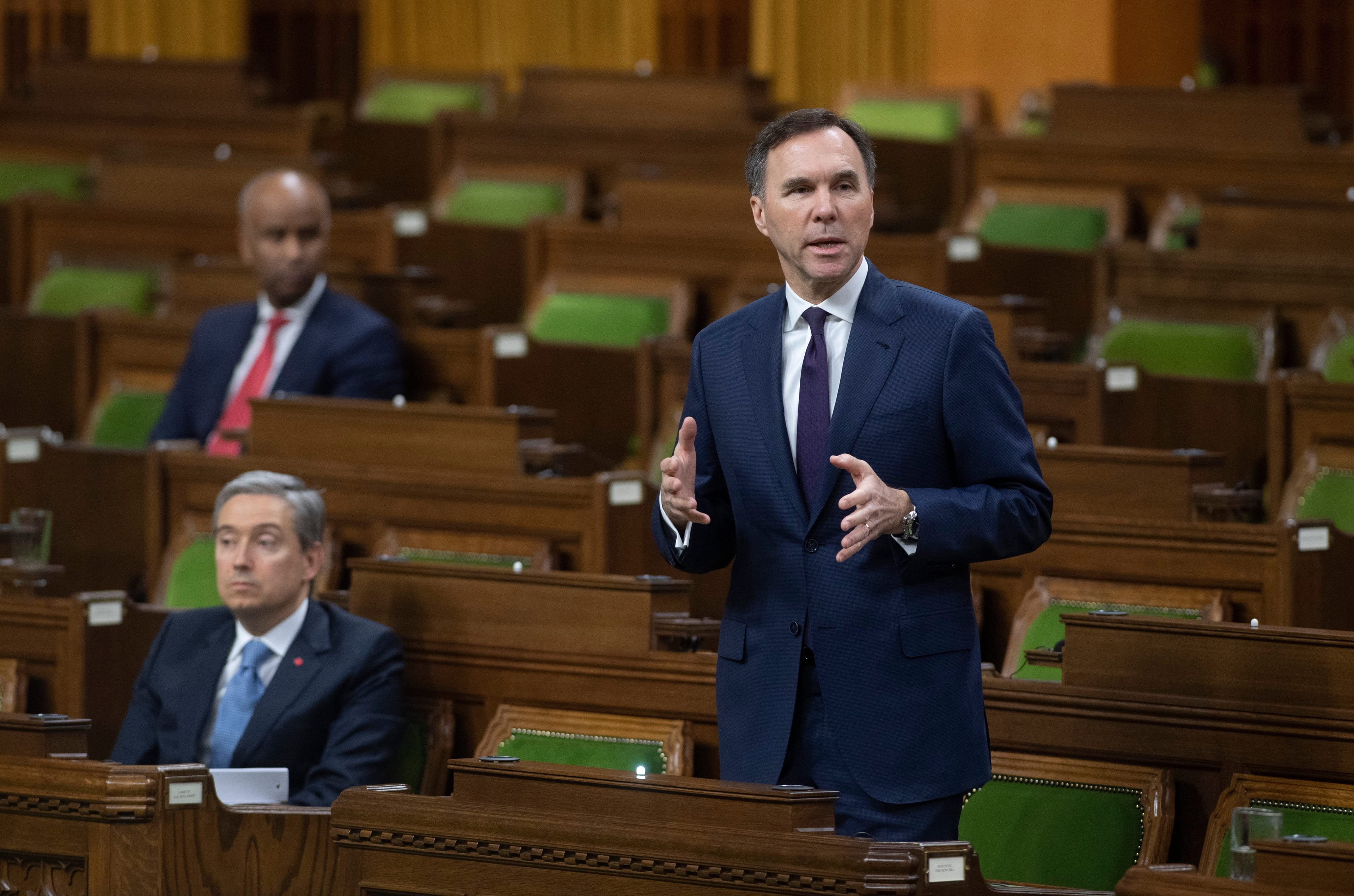 Morneau responds to a question after tabling the governments COVID-19 financial measures bill in the House of Commons on March 25, 2020 (CP/Adrian Wyld)