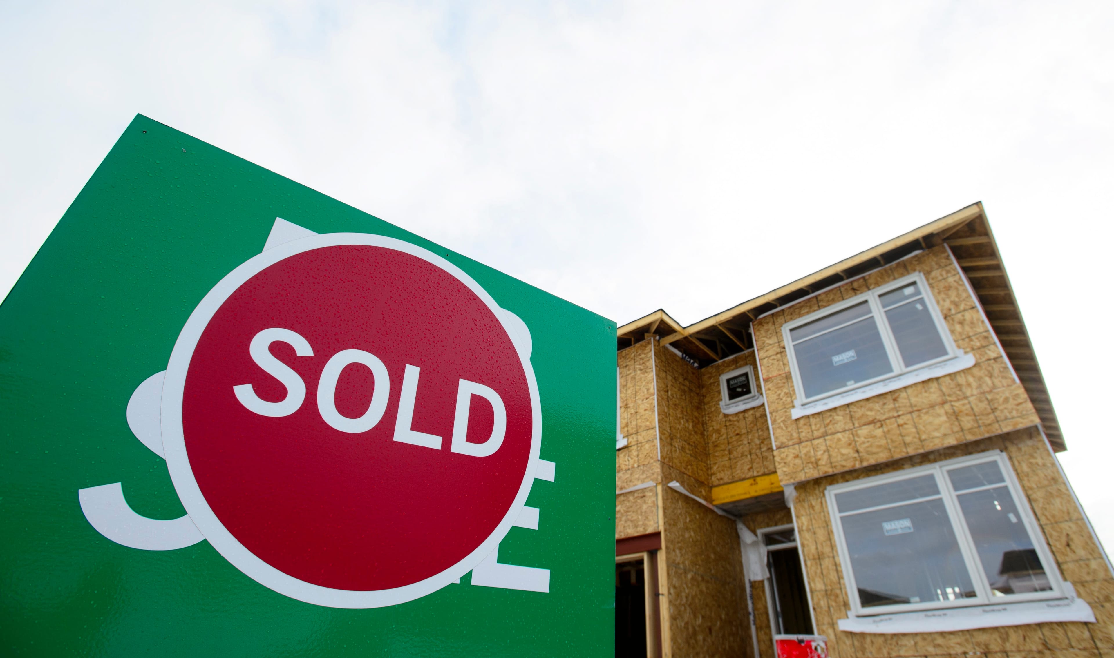 'For Sale' signs sell new homes in Beckwith, Ont., on Wednesday, Jan. 11, 2018. (Sean Kilpatrick/CP)