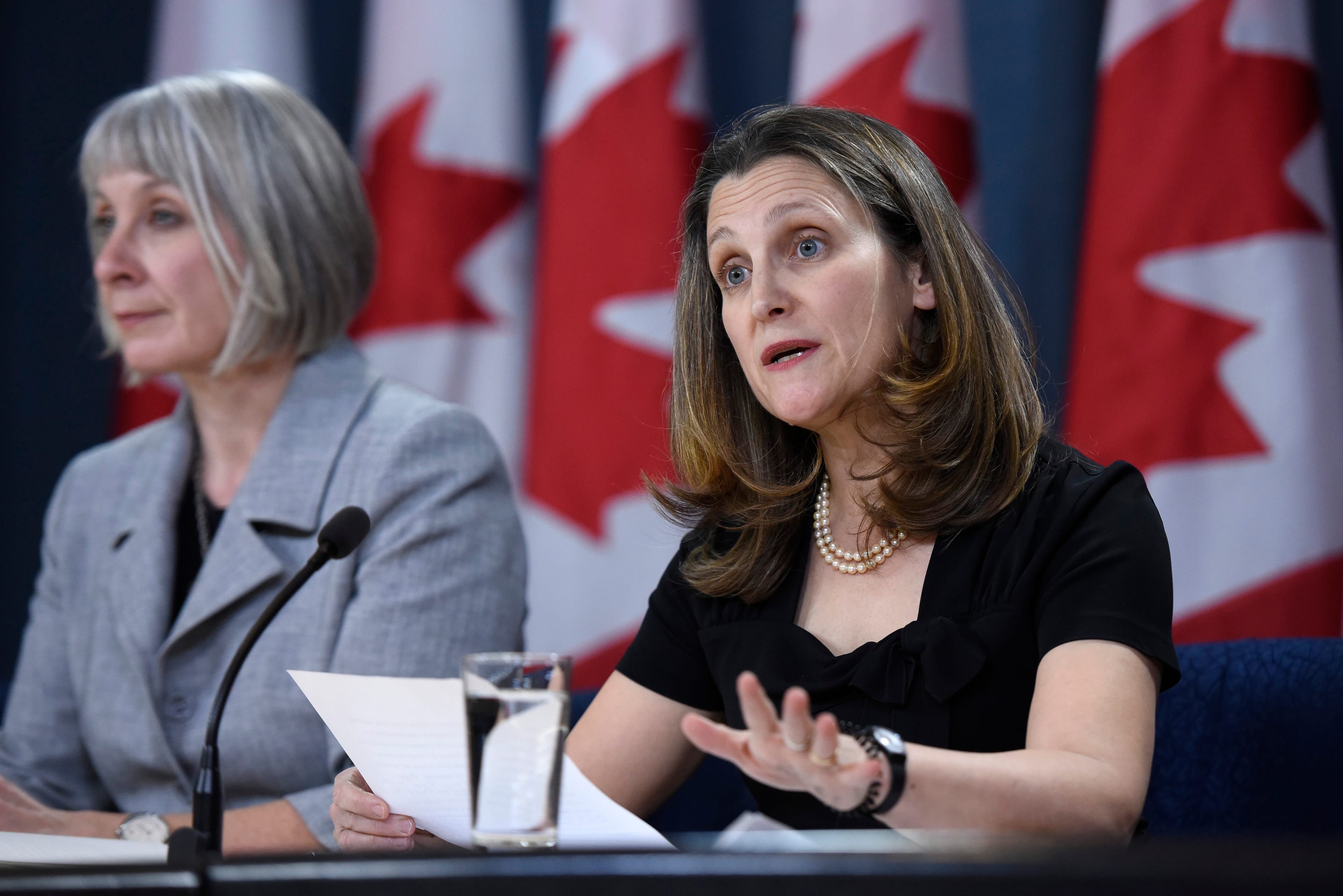 Minister of Health Patty Hajdu listens as Deputy Prime Minister Chrystia Freeland speaks during an update on coronavirus disease (COVID-19) at the National Press Theatre in Ottawa, on March 4, 2020. (Justin Tang/CP)