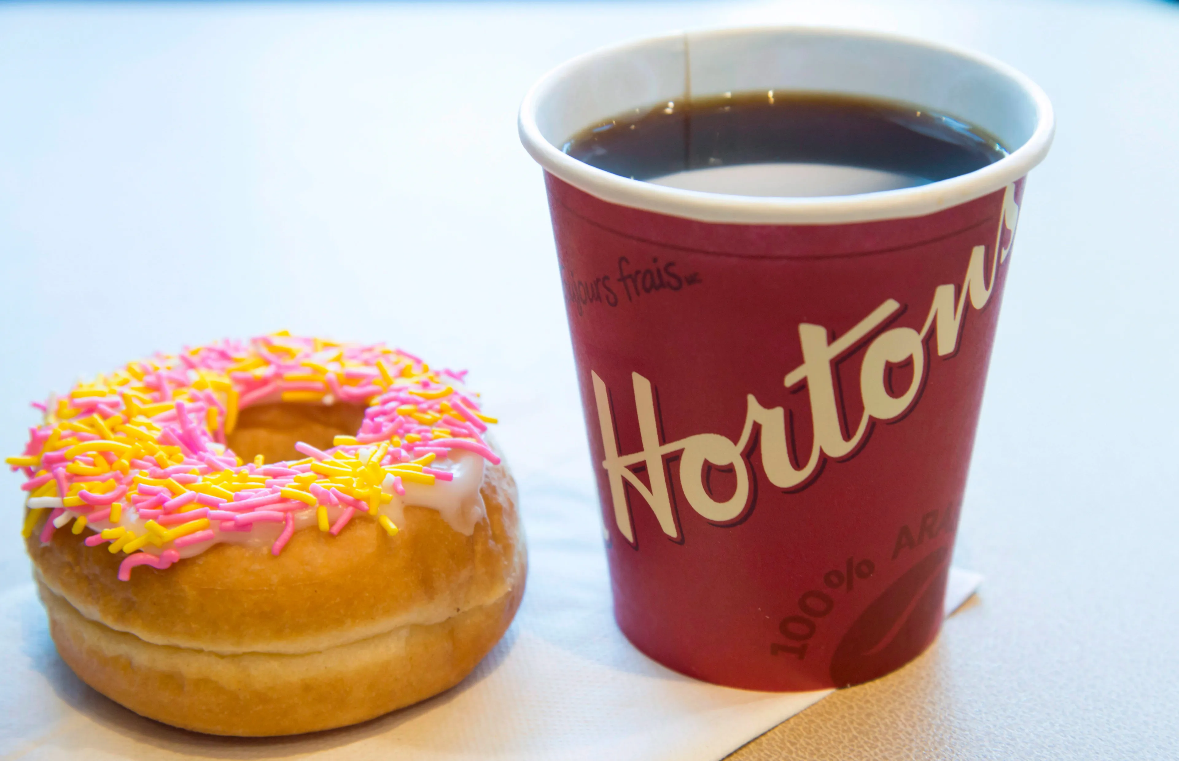 A coffee and donut from Tim Hortons is shown at a Coquitlam B.C., location on Thursday, April 26, 2018. (Jonathan Hayward/CP)