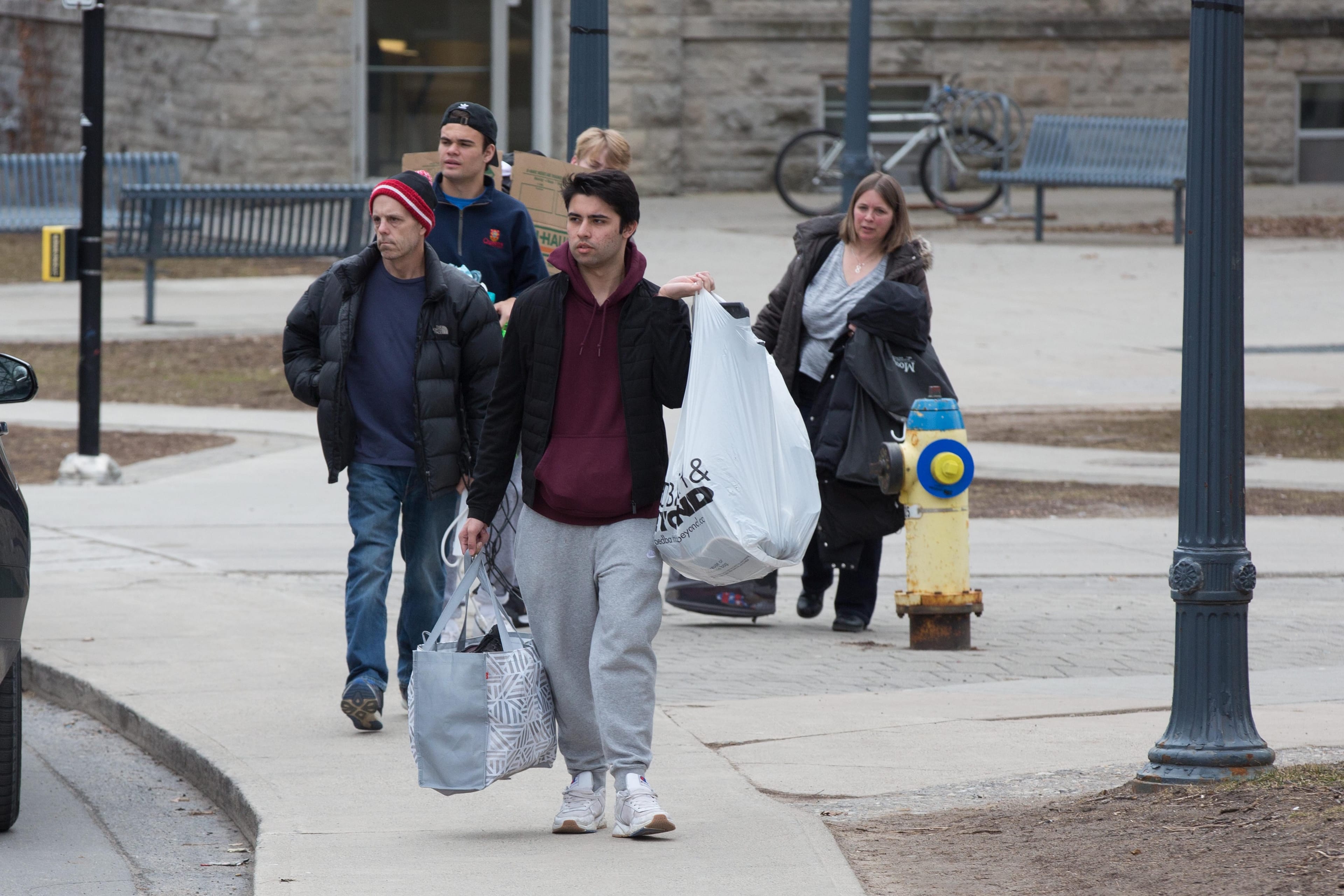 Queen's University students move out from residence in Kingston, Ont., on Wednesday, March 18, 2020. THE CANADIAN PRESS/Lars Hagberg