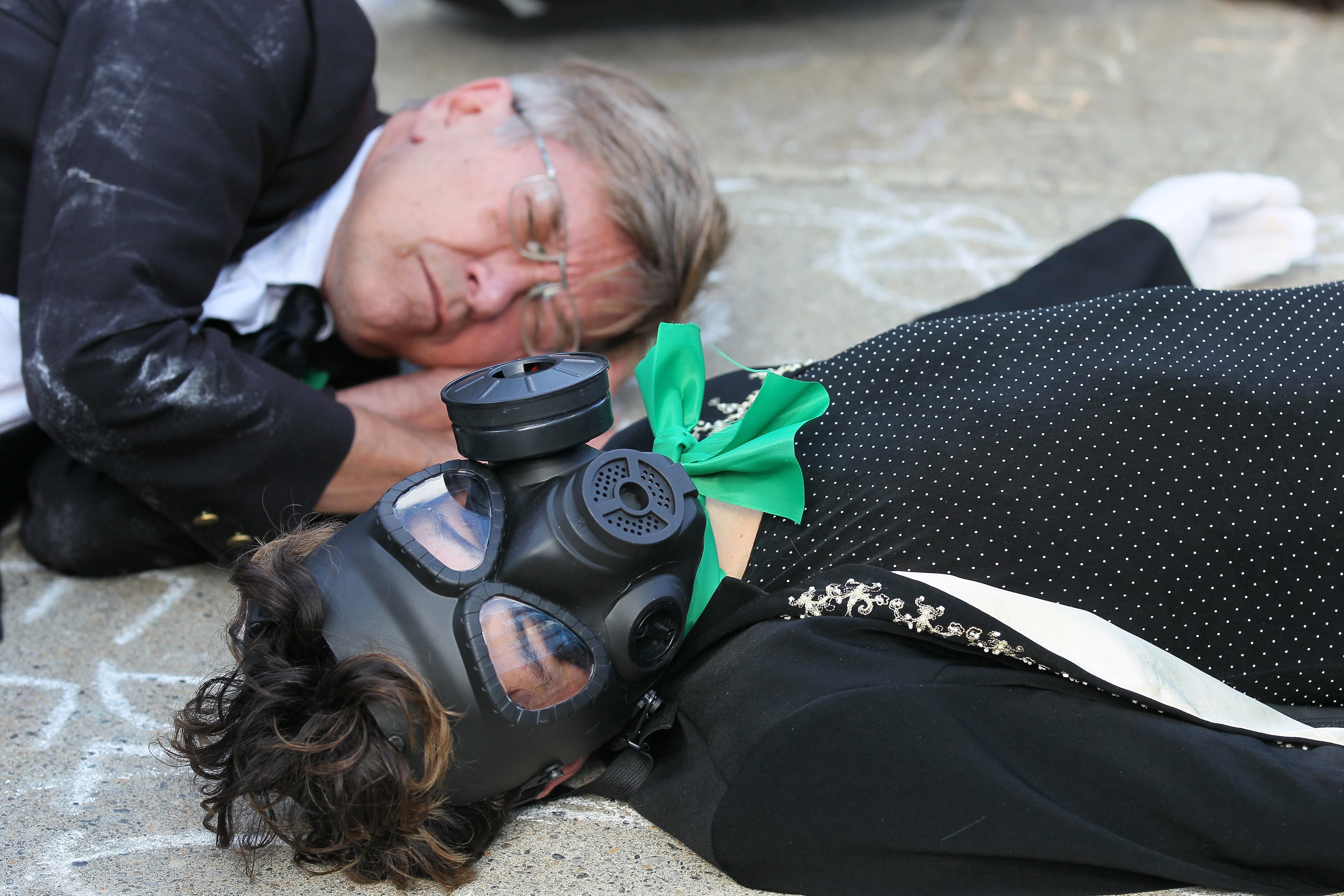 TRAction Art Group performing an intervention on the steps of the Calgary Municipal Building during the Climate Parade on Friday, Sept. 20, 2019. (Dave Chidley/CP)