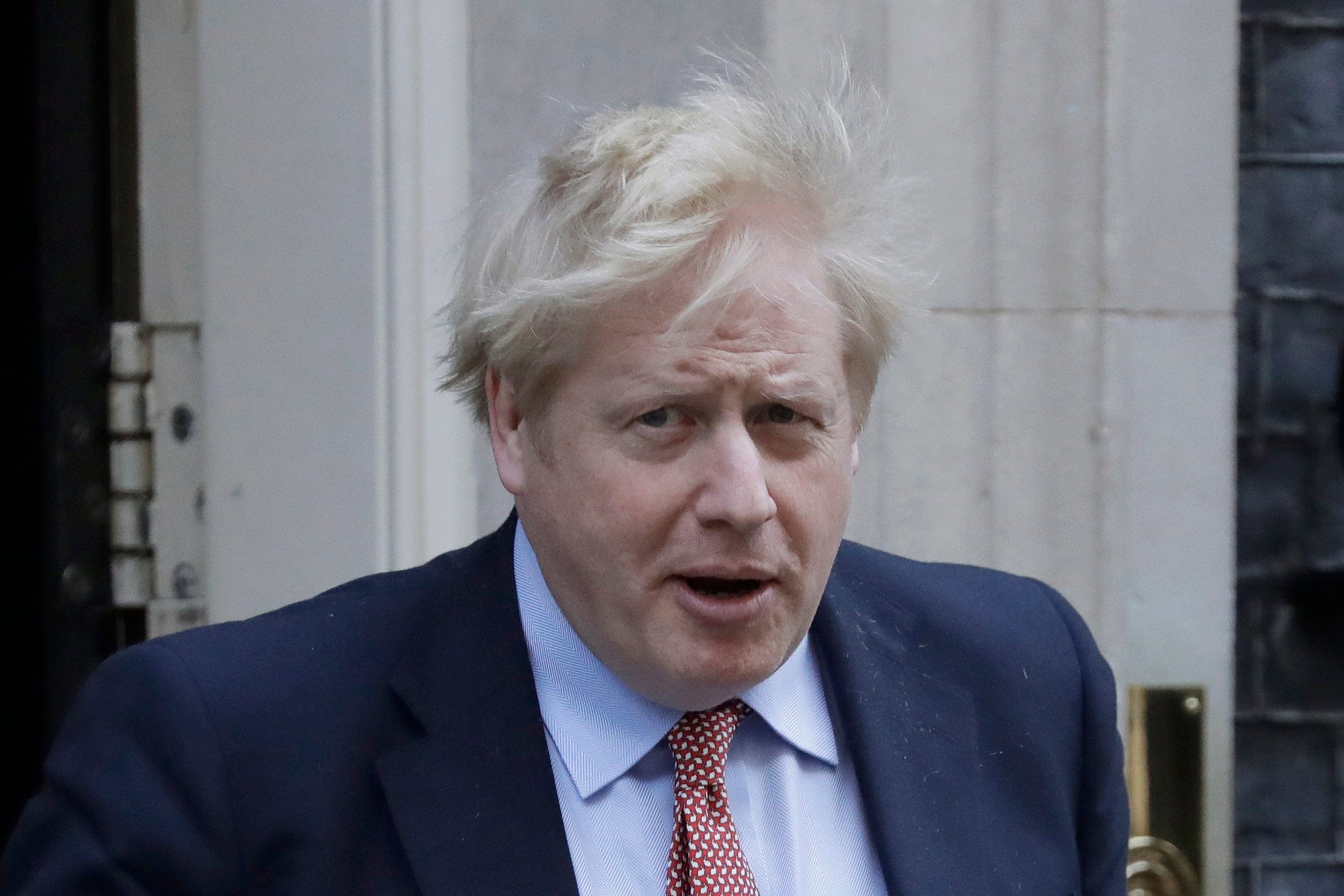 In this Wednesday, March 25, 2020 file photo, Britain's Prime Minister Boris Johnson leaves 10 Downing Street for the House of Commons for his weekly Prime Ministers Questions, in London. (Matt Dunham/AP)