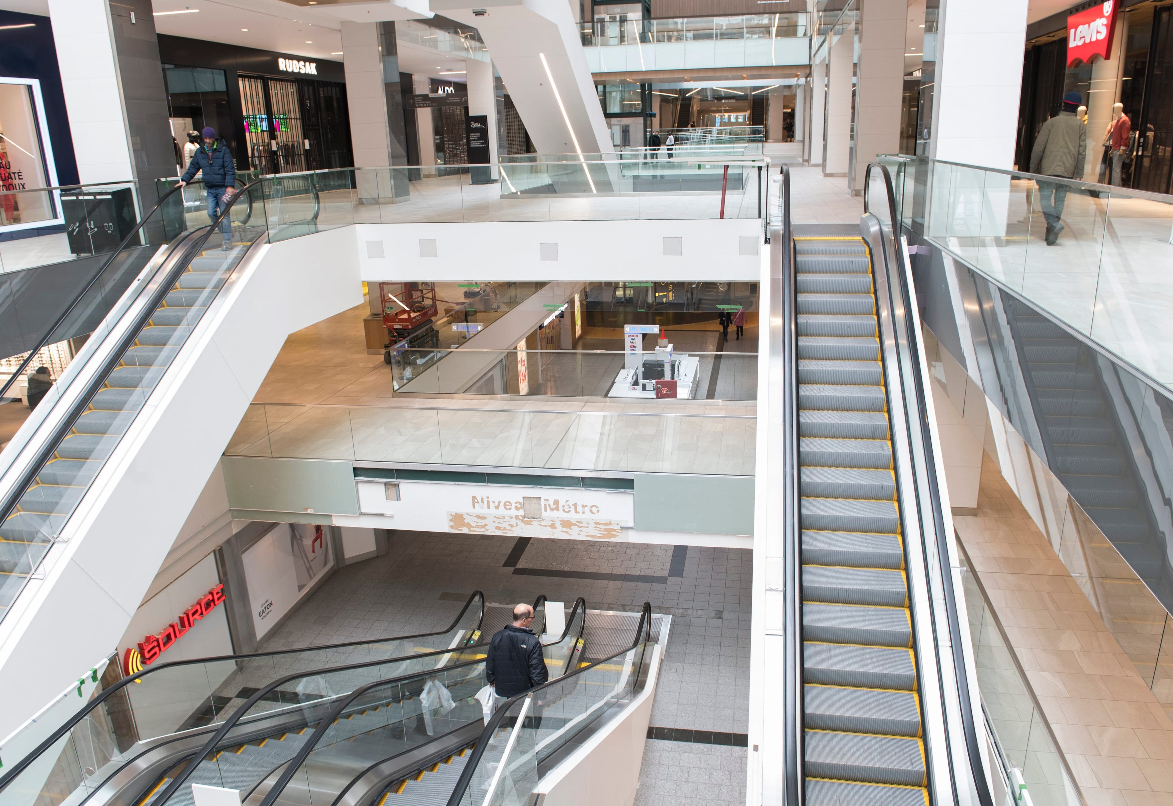 An almost empty shopping mall is shown in downtown Montreal, Wednesday, March 18, 2020, as Coronavirus COVID-19 cases rise in Canada and around the world. (CP/Graham Hughes)