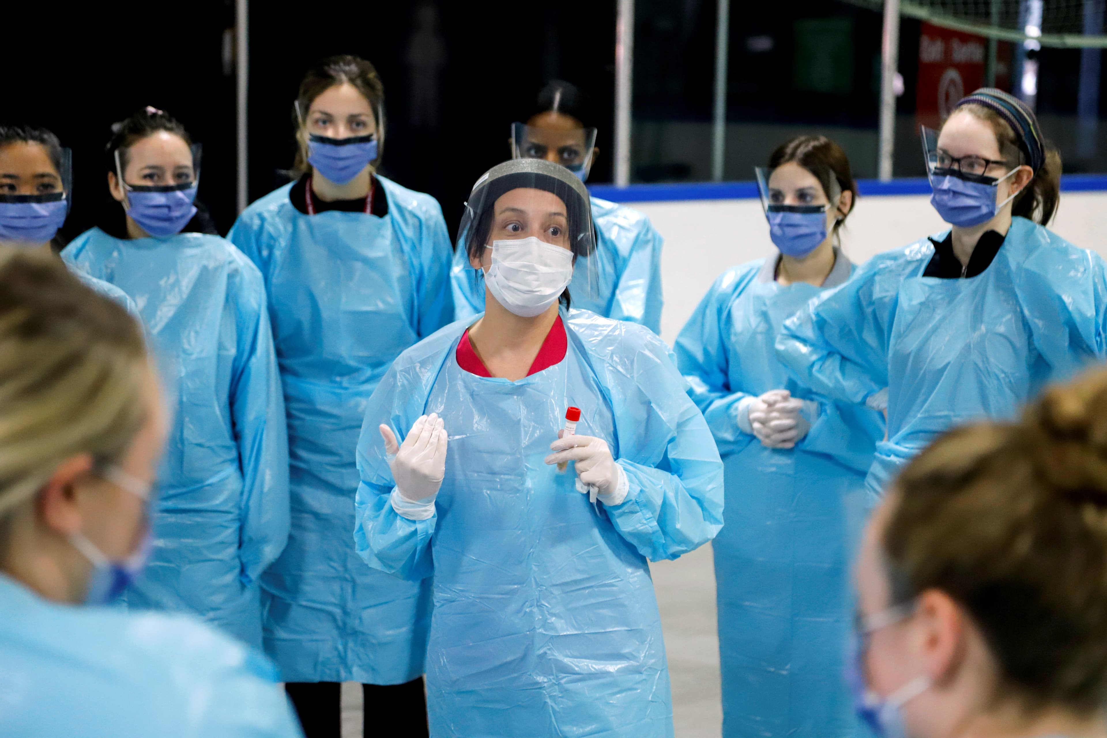 Medical staff prepare to receive patients for coronavirus screening at a temporary assessment center at the Brewer hockey arena in Ottawa