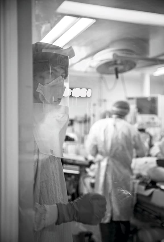 From inside the resuscitation room, emergency nurse Michael De Wit communicates the team leader’s requests to the ‘runner doctor’ who supports the team from the outside by gathering further details from paramedics or the patient’s medical records. (Dawn Lim)