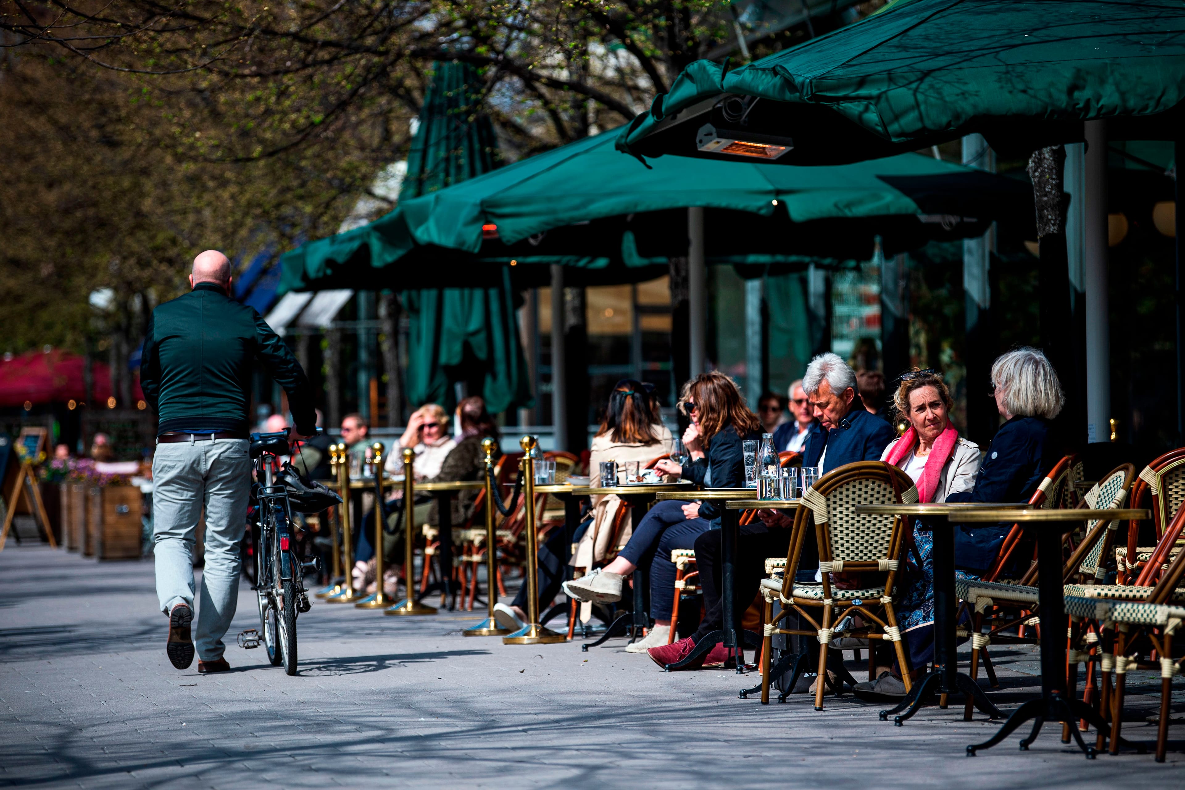 People sit in a restaurant in Stockholm on May 8, 2020 (JONATHAN NACKSTRAND/AFP via Getty Images)