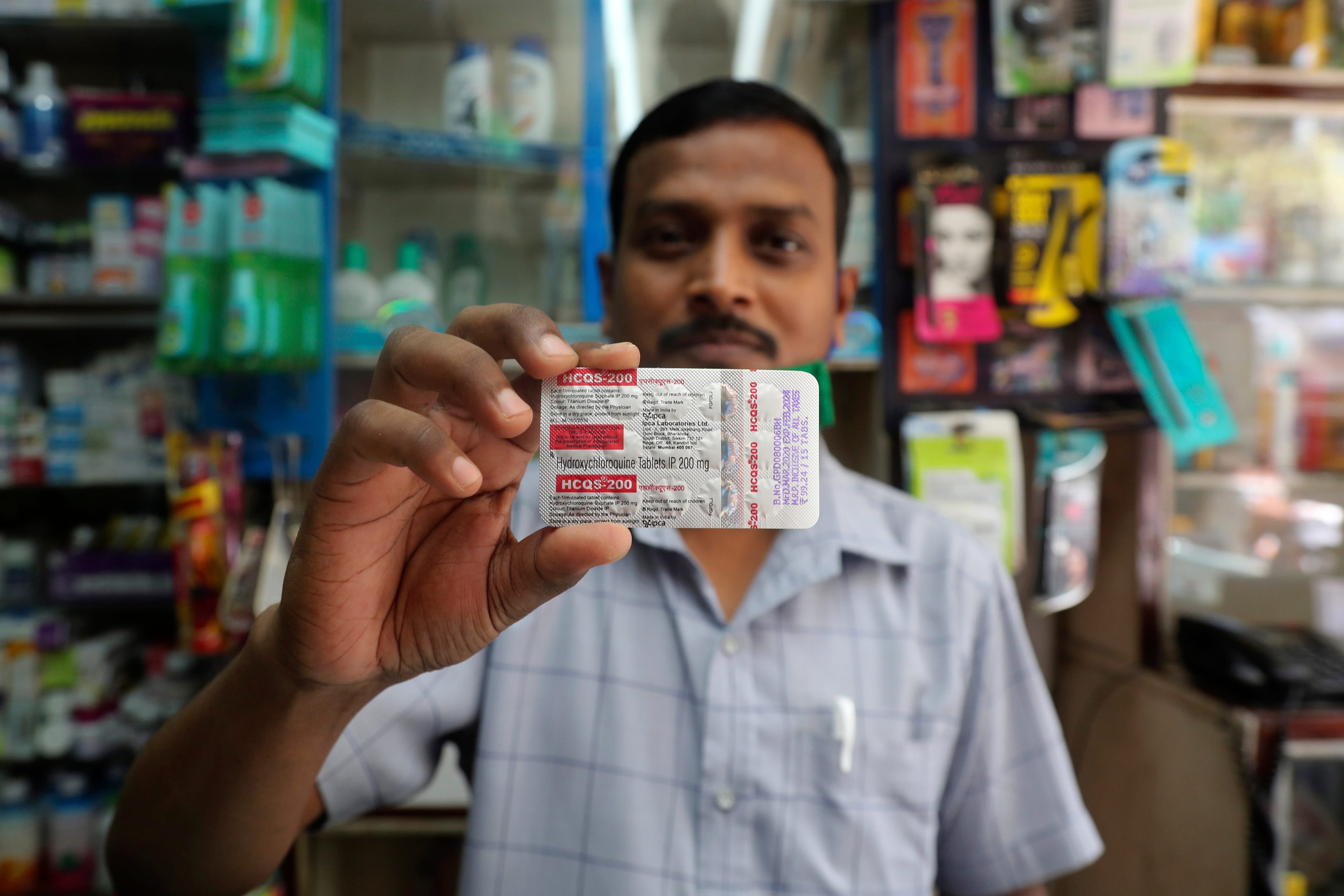A chemist displays hydroxychloroquine tablets in Mumbai, India, on May 19, 2020. Trump's previous endorsement of hydroxychloroquine catalyzed a tremendous shift in the country, spurring the worlds largest producer of the drug to make much more of it. (Rafiq Maqbool/AP/CP)
