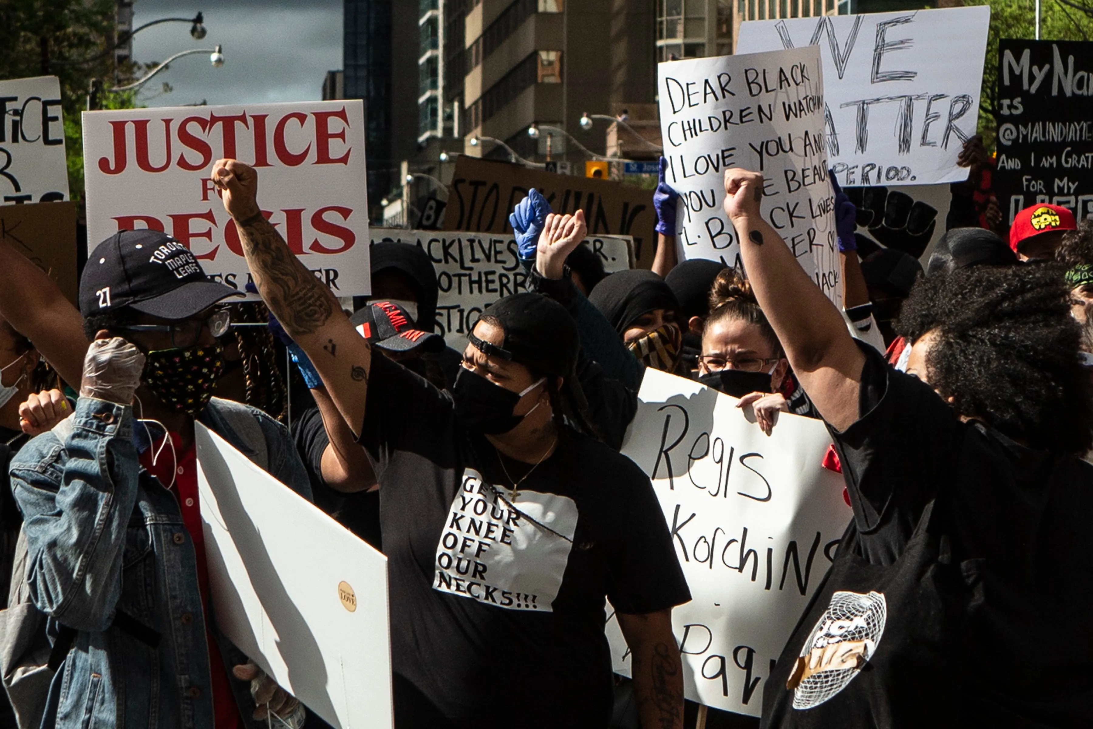 Demonstrators take part in a rally protesting the death of Regis Korchinski-Paquet in downtown Toronto, Saturday May 30, 2020. Korchinski-Paquet, 29, fell from the balcony of a 24th-floor Toronto apartment while police were in the home. THE CANADIAN PRESS/Chris Young