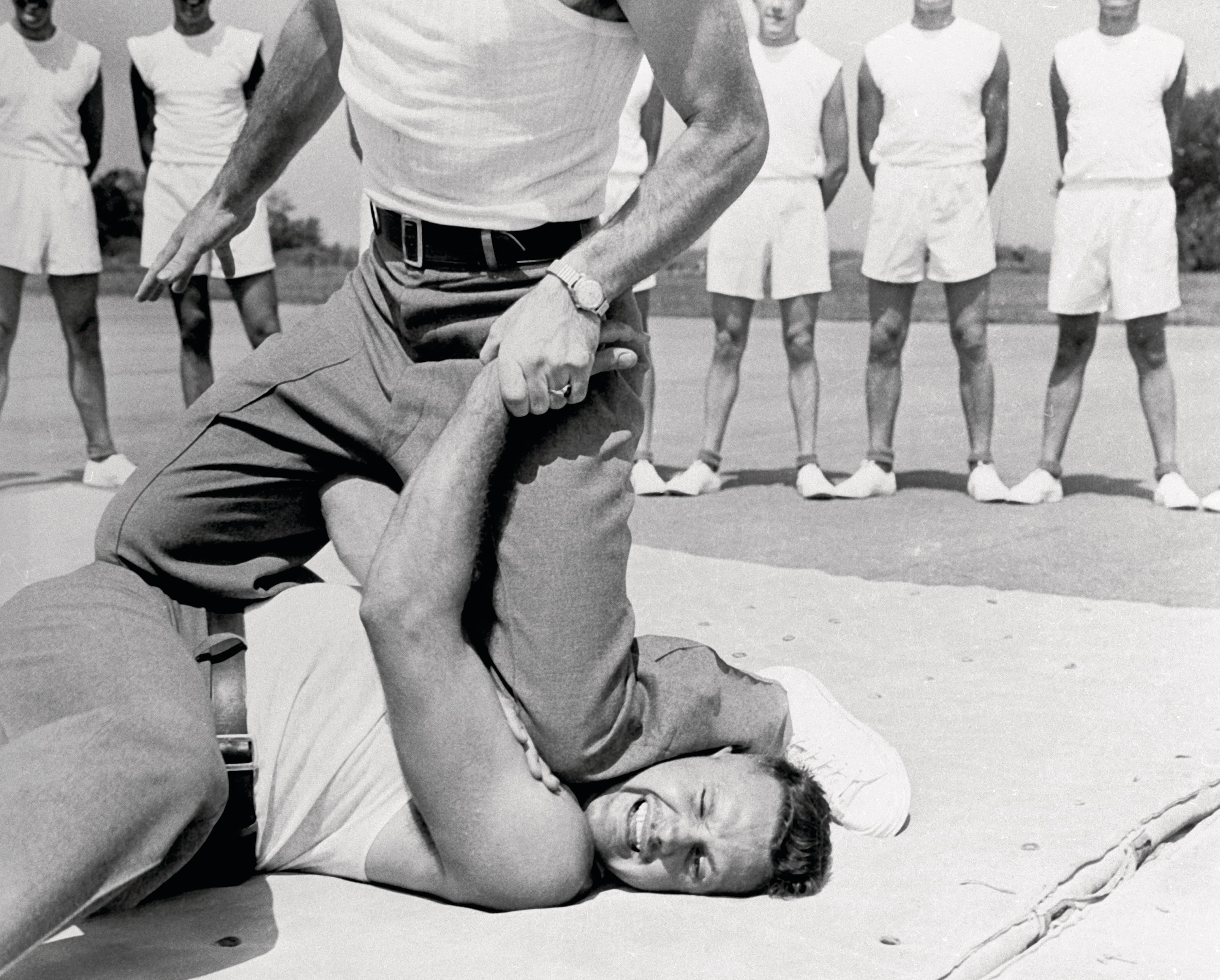 A recruit is subdued during training at the RCMP Academy in 1957 (Metro/BIPs/Getty Images)
