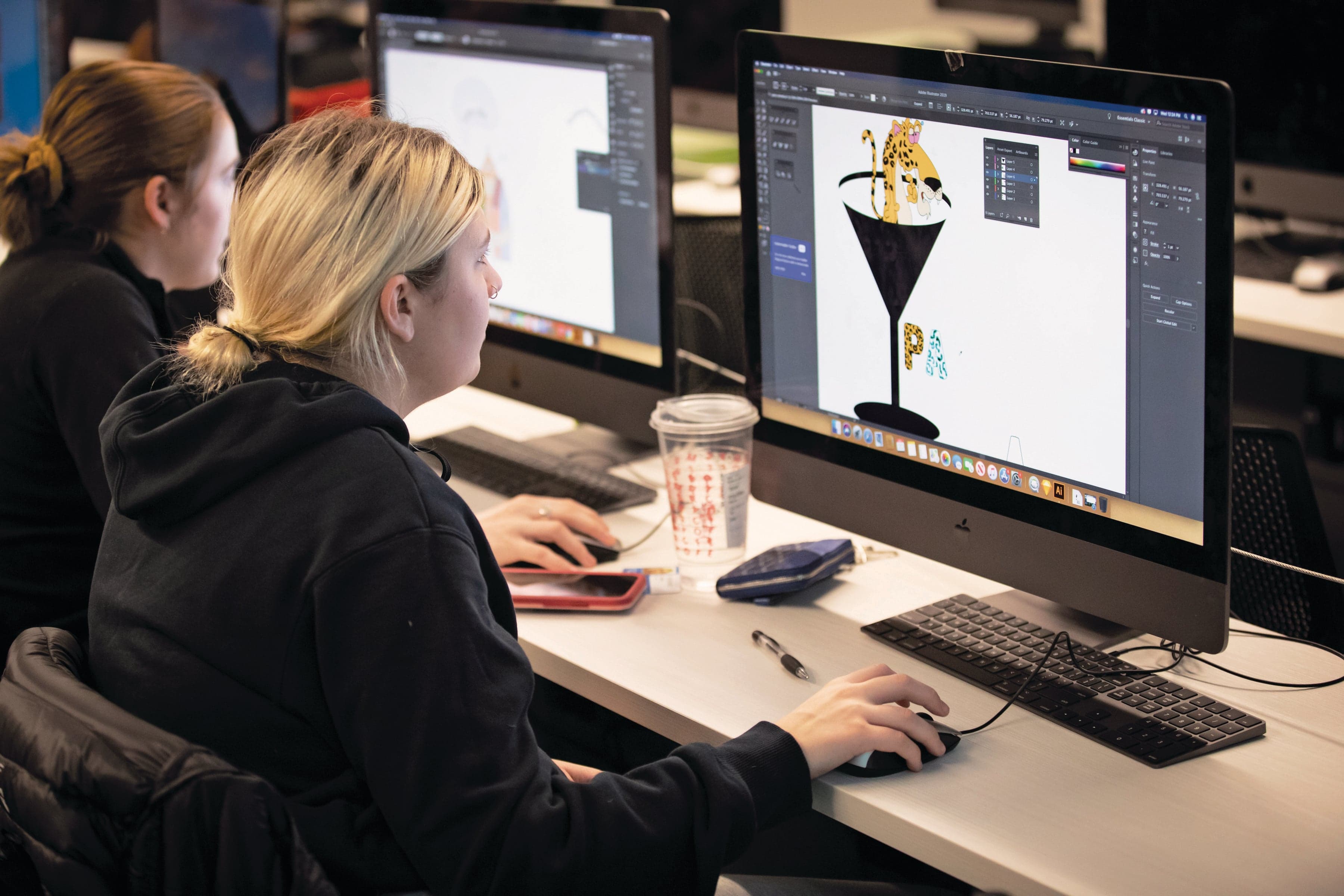 Student in graphic design program working on design project on computer at the Centre for Arts, Design. (George Brown College)