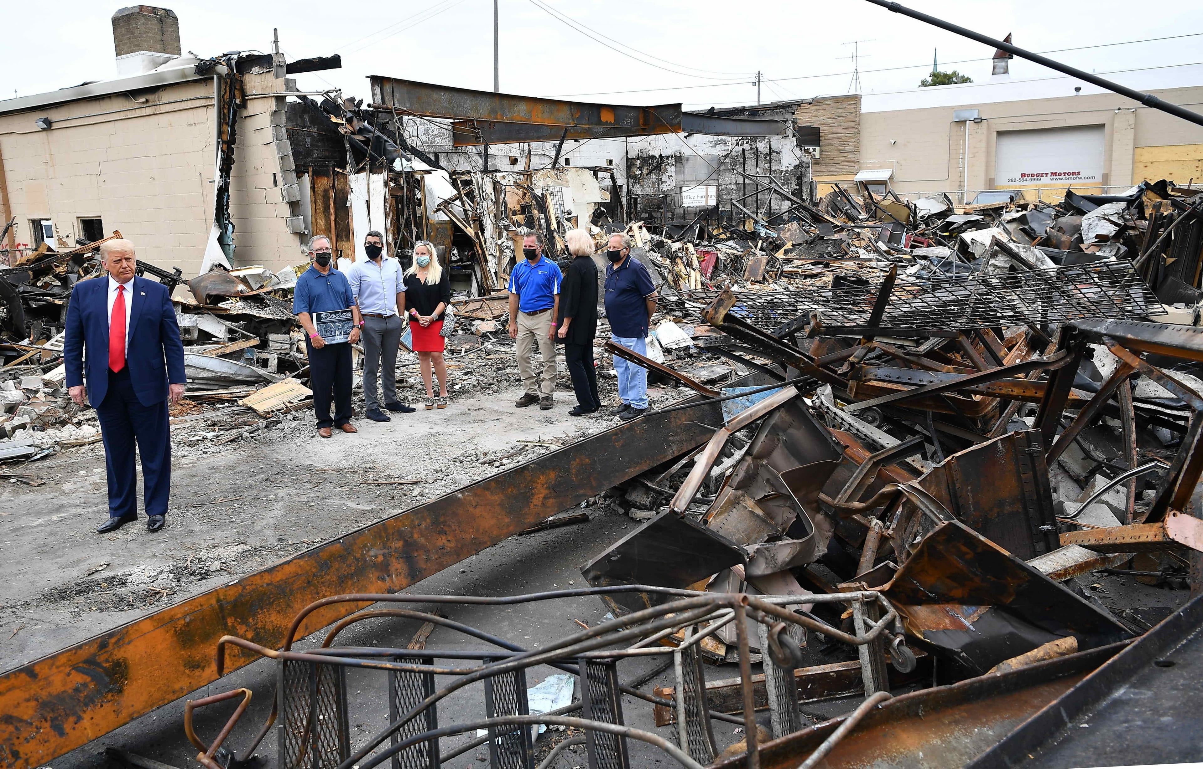 US President Donald Trump tours an area affected by civil unrest in Kenosha, Wisconsin on September 1, 2020. - Trump said Tuesday on a visit to protest-hit Kenosha, Wisconsin that recent anti-police demonstrations in the city were acts of "domestic terror" committed by violent mobs. "These are not acts of peaceful protest but really domestic terror," Trump said, describing multiple nights of angry demonstrations last week after a white police officer in Kenosha shot a black man in the back at close range. (Mandel Ngan/AFP/Getty Images)
