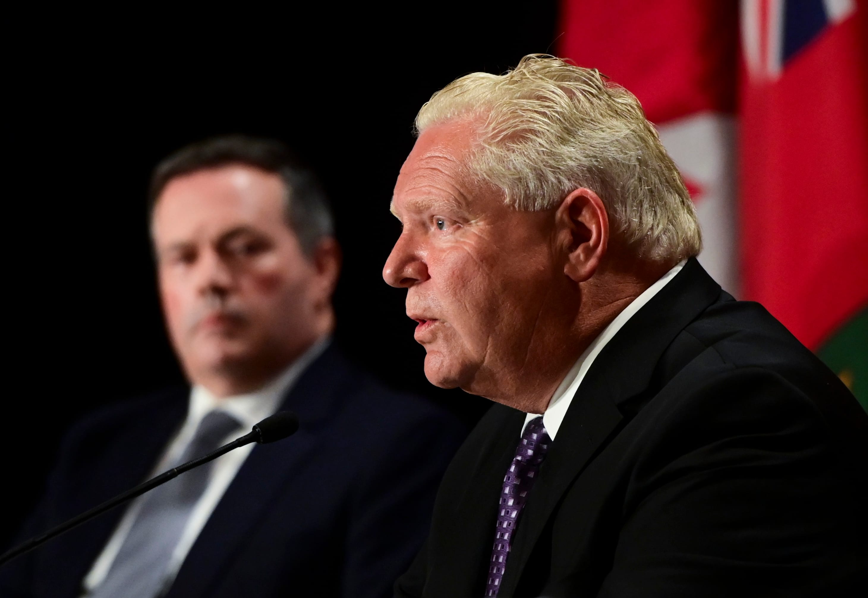 Ontario Premier Doug Ford speaks as Alberta Premier Jason Kenney looks on during a press conference in Ottawa on Friday, Sept. 18, 2020. THE CANADIAN PRESS/Sean Kilpatrick
