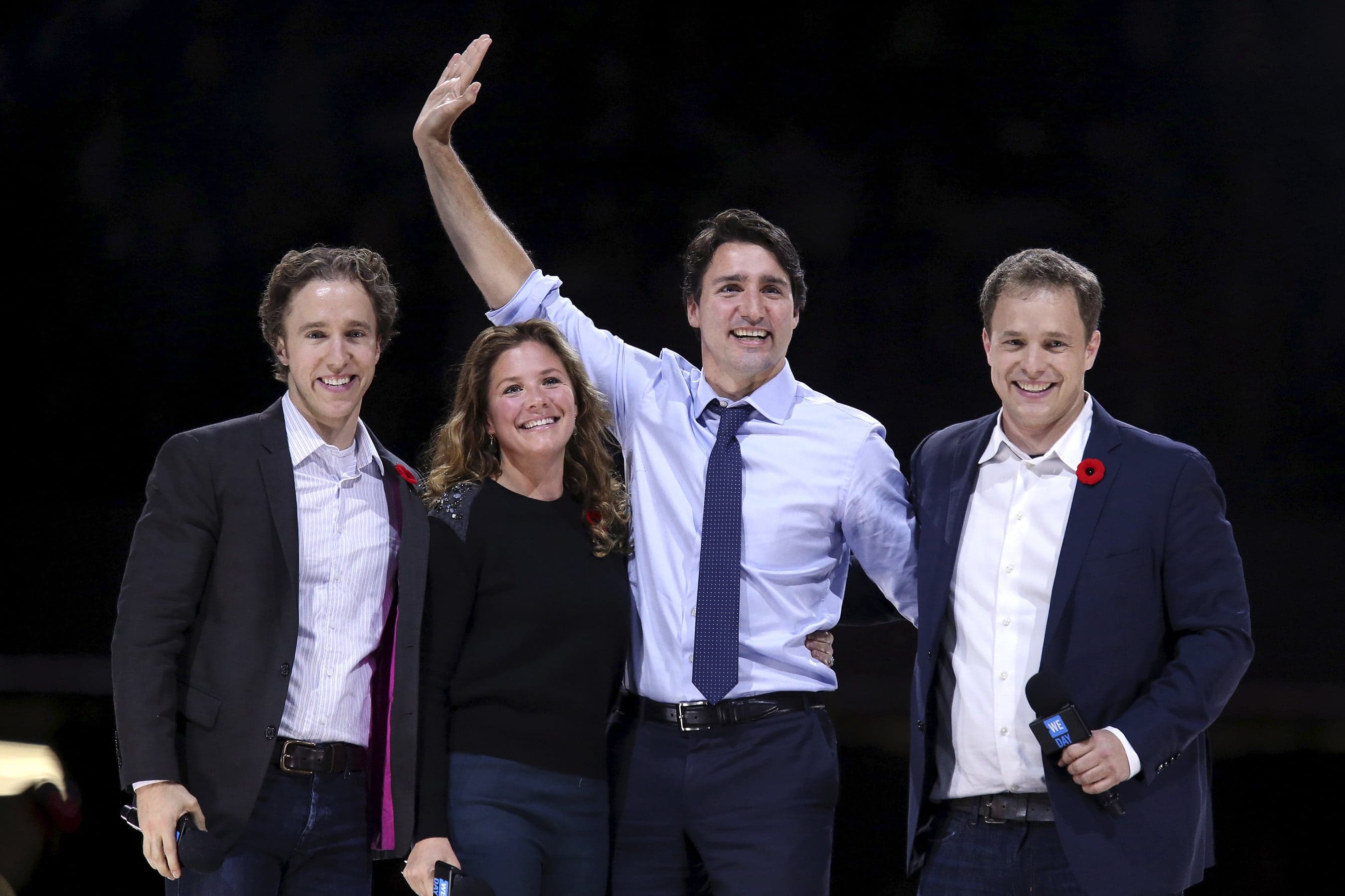 Craig, Grégoire Trudeau, the PM and Marc onstage for a WE Day in Ottawa in 2015 (Chris Wattie/Reuters)