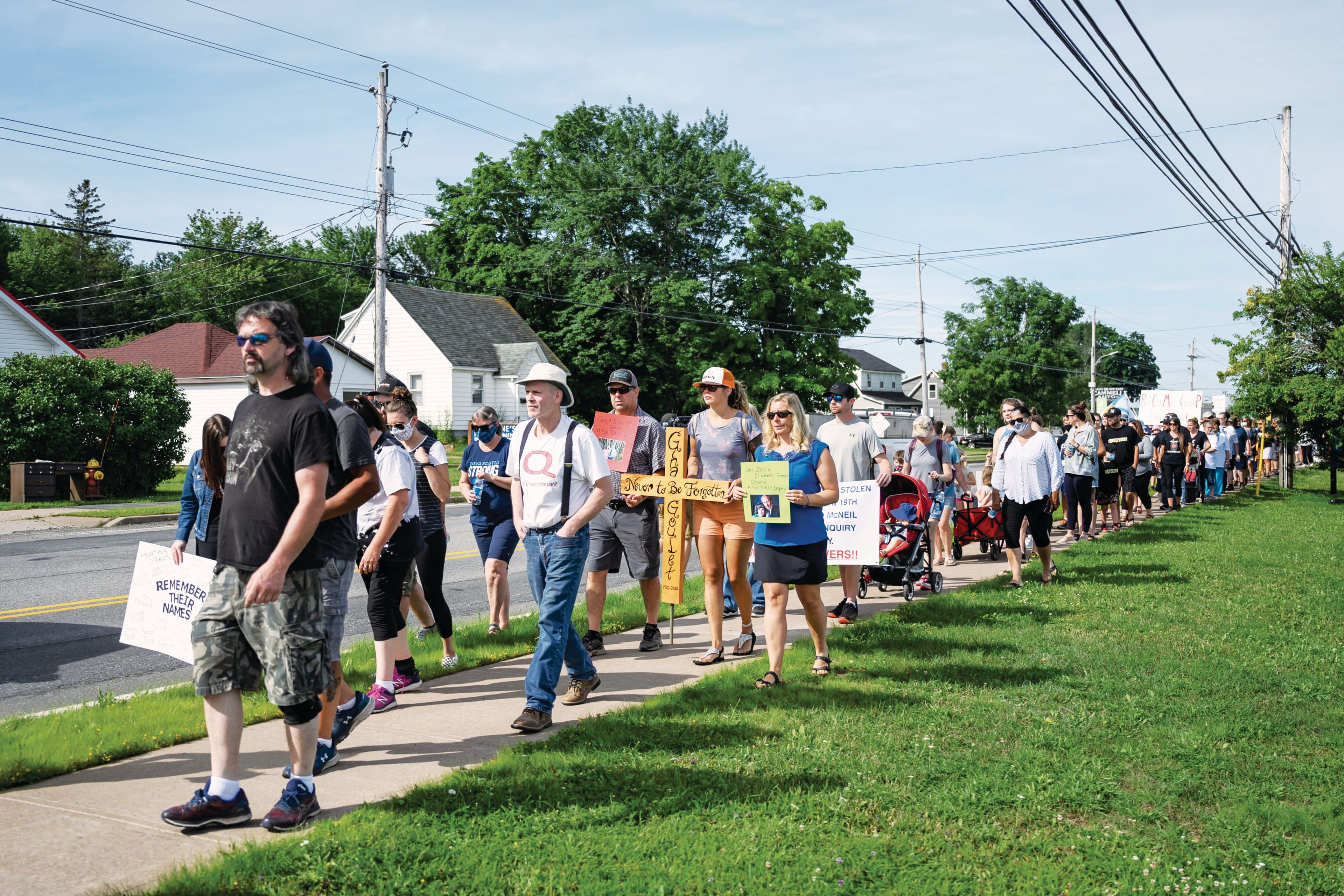 Harry Bond leadS the group of grieving families, who gathered to march in Bible Hill, N.S. on Wednesday, July 22, 2020 demanding a public inquiry into the RCMP's handling of Canada's deadliest rampage throughout rural Nova Scotia in April. (Photograph by Darren Calabrese)