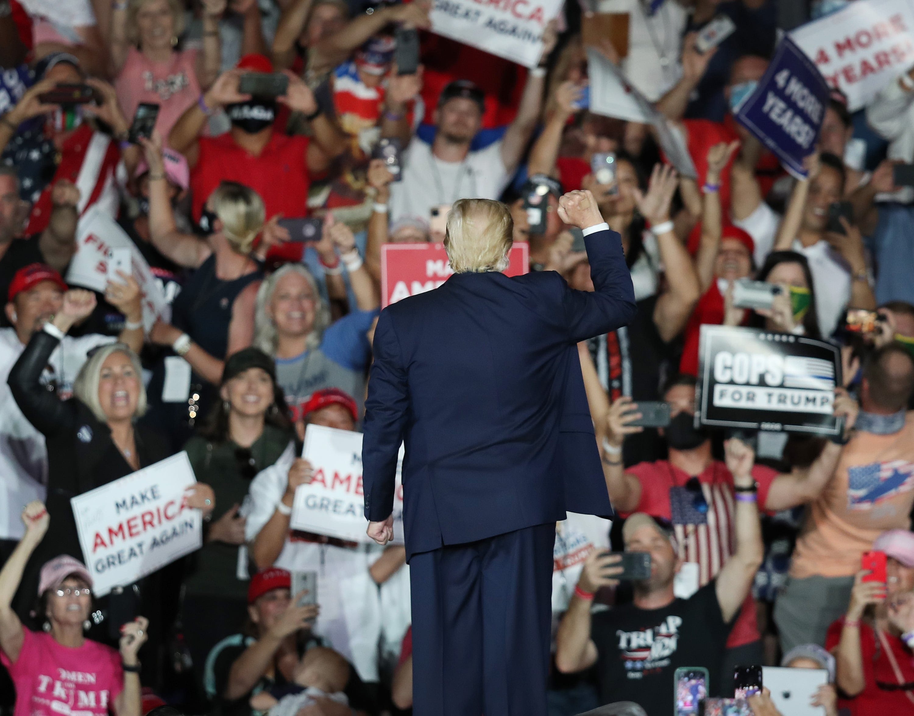 Trump waves to the crowd as he leaves after speaking during a campaign event at the Orlando Sanford International Airport on Oct. 12, 2020 in Sanford, Florida (Joe Raedle/Getty Images)