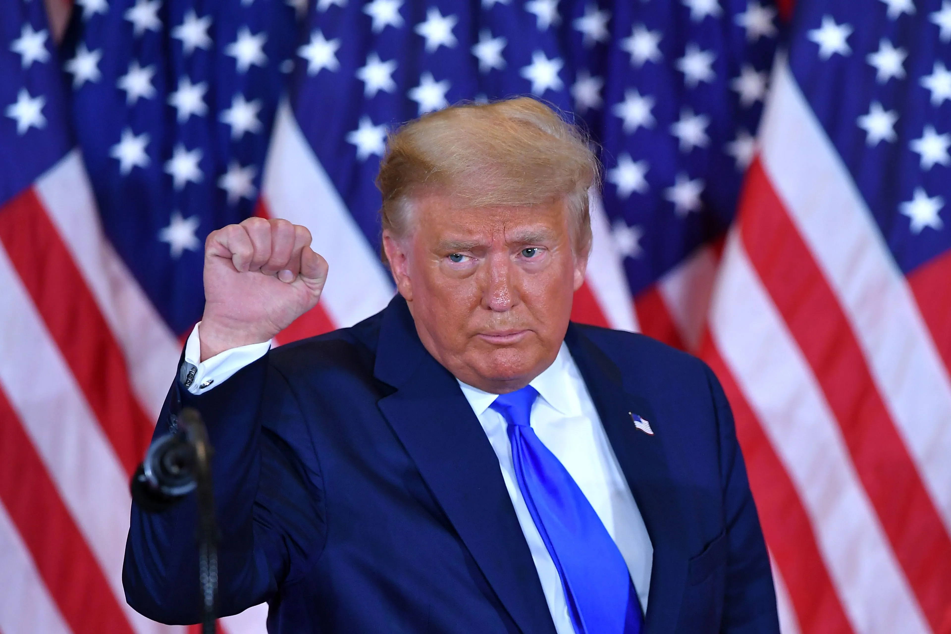 TOPSHOT - US President Donald Trump pumps his fist after speaking during election night in the East Room of the White House in Washington, DC, early on November 4, 2020. (Photo by MANDEL NGAN / AFP) (Photo by MANDEL NGAN/AFP via Getty Images)