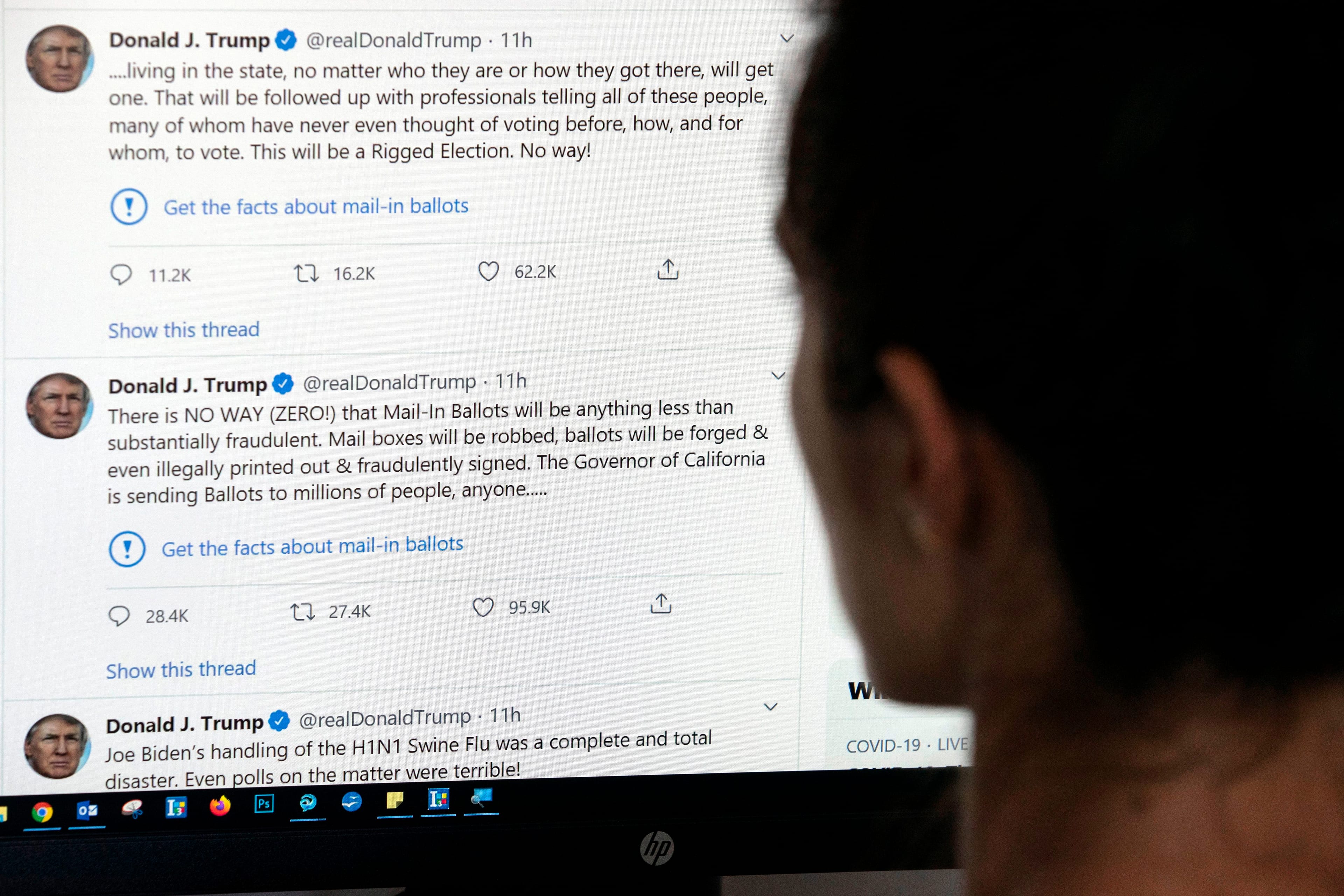 An editor in Los Angeles looks at the official Twitter account of U.S. President Donald Trump on May 26, 2020 (AFP via Getty Images)