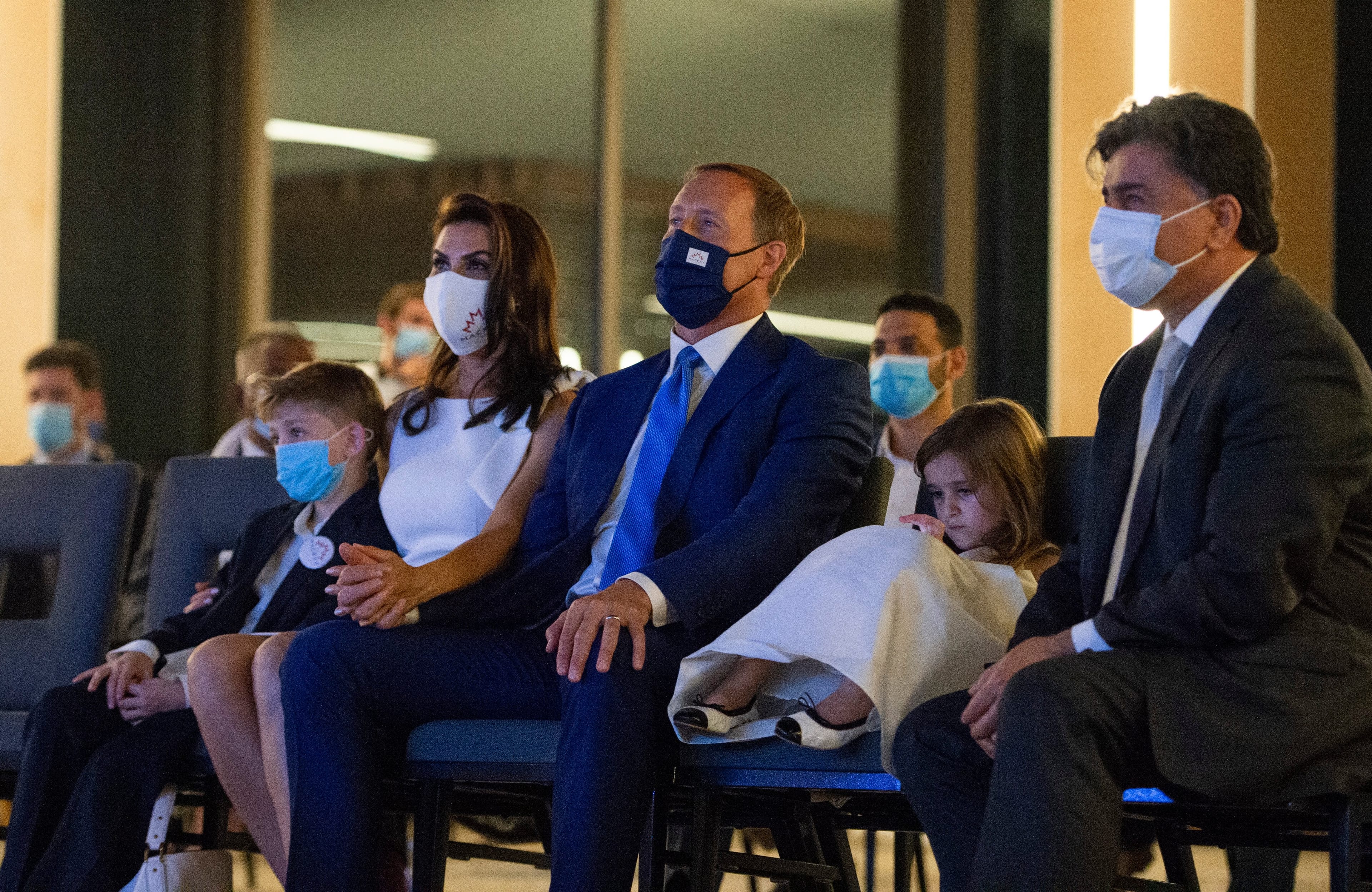 Peter MacKay, leadership candidate for the Conservative Party of Canada, watches a broadcast show that announced the party's new leader with his wife Nazanin Afshin-Jam MacKay, their children Kian, 7, and Valentia, 4, and father-in-law Afshin Afshin-Jam, in Ottawa on Sunday, Aug. 23, 2020. (Justin Tang/CP)