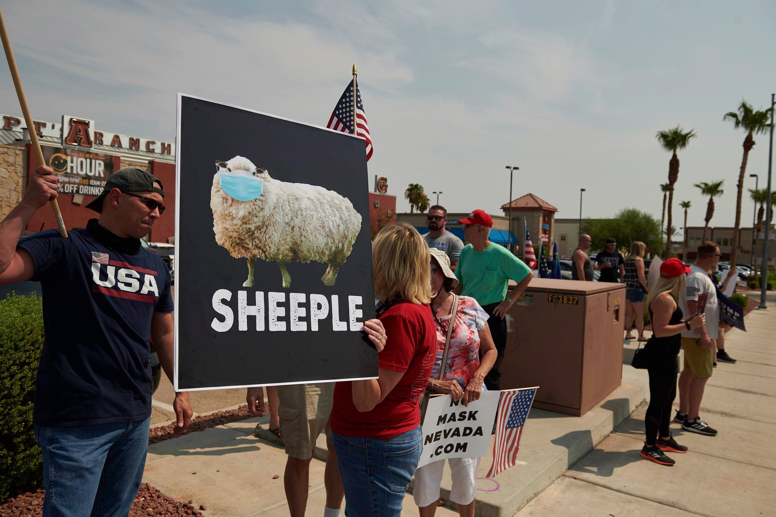 With some glaring exceptions, people are wearing masks as a way to show compassion for others (Bridget Bennett/AFP/Getty Images)