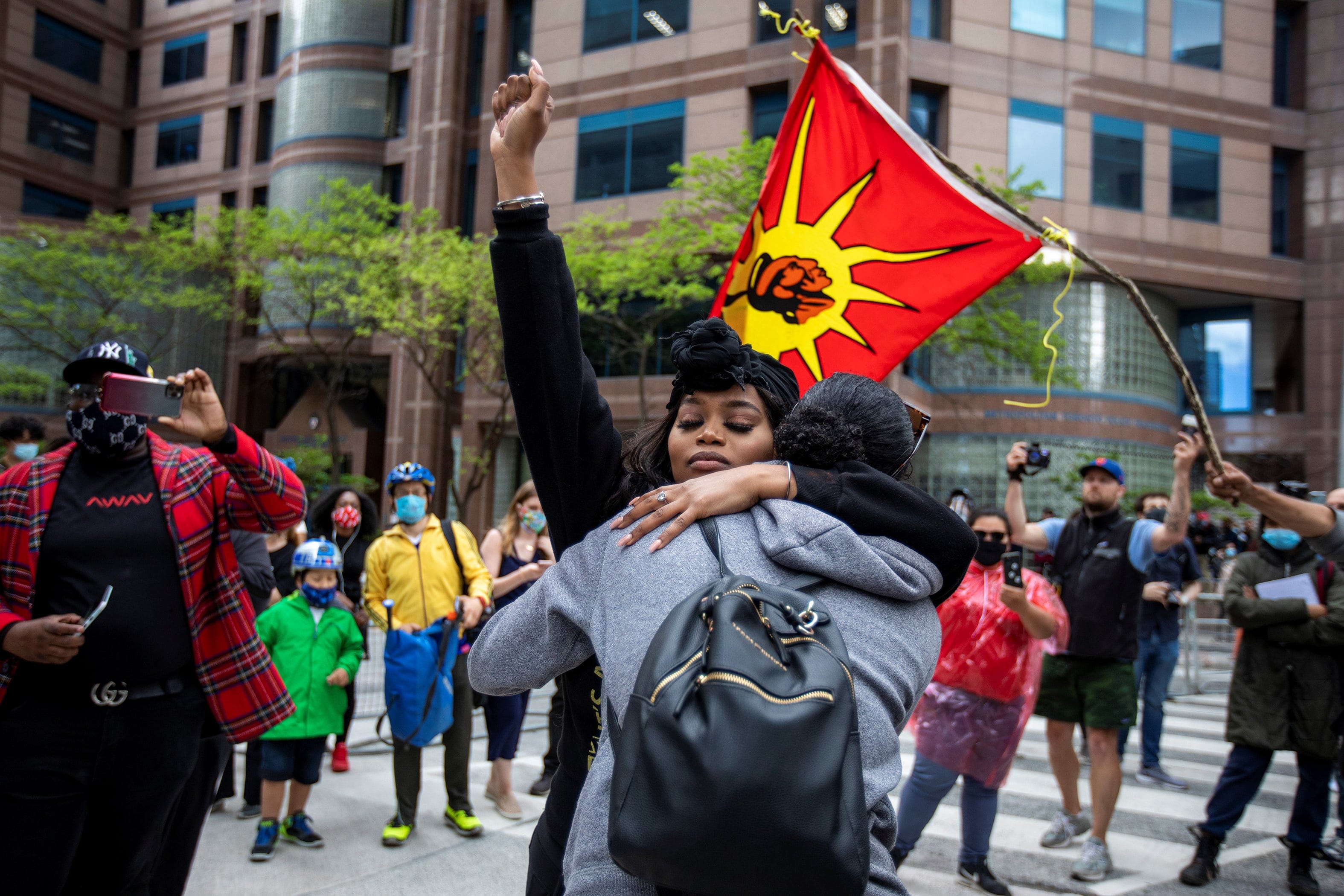 Outside Toronto Police headquarters, protesters highlight the deaths in the U.S. of Ahmaud Arbery, Breonna Taylor and George Floyd, and of Toronto's Regis Korchiniski-Paquet (Carlos Osorio/Reuters)