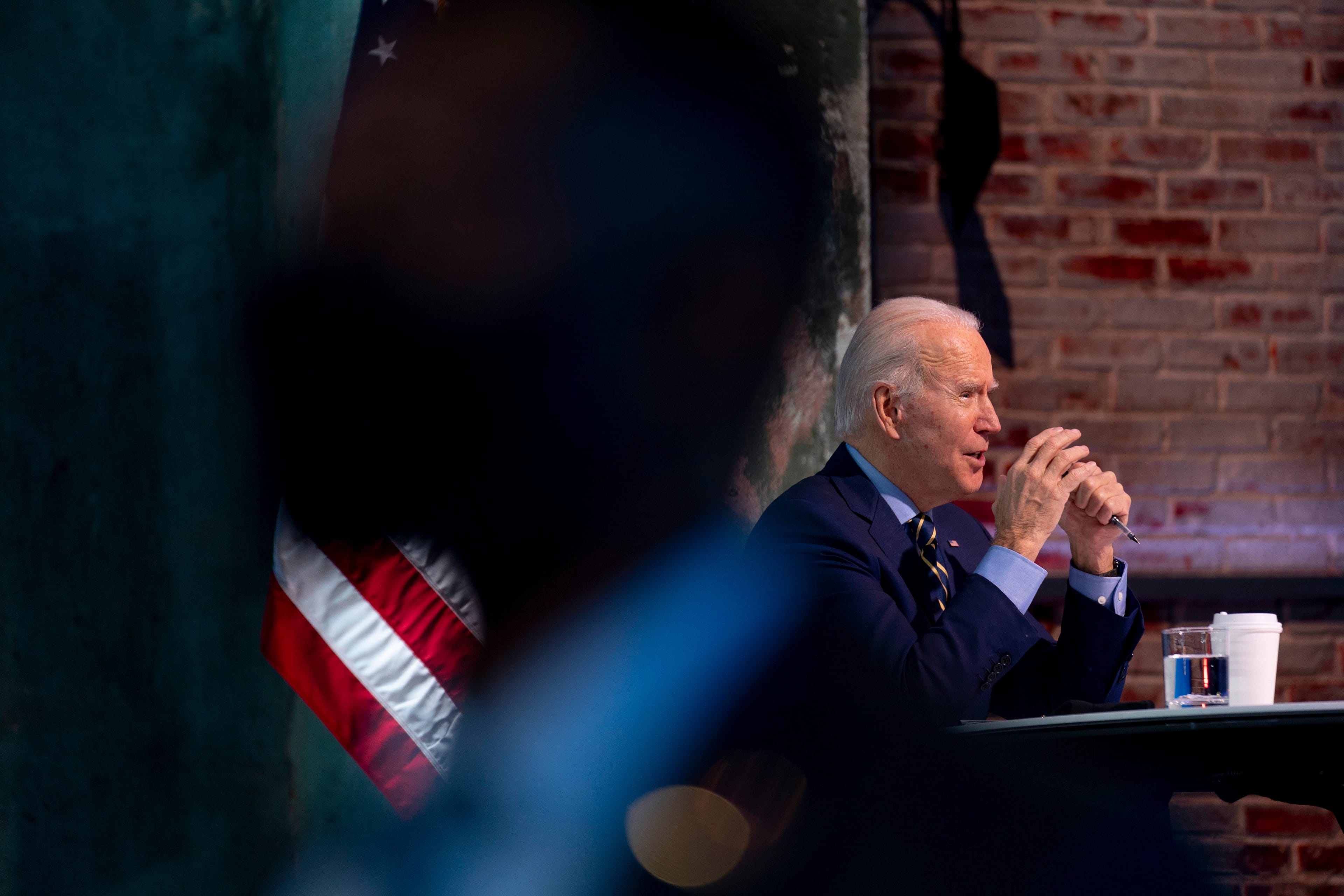 Biden at a recent virtual meeting with members of his national-security and foreign-policy agency review teams. (Andrew Harnik/AP)