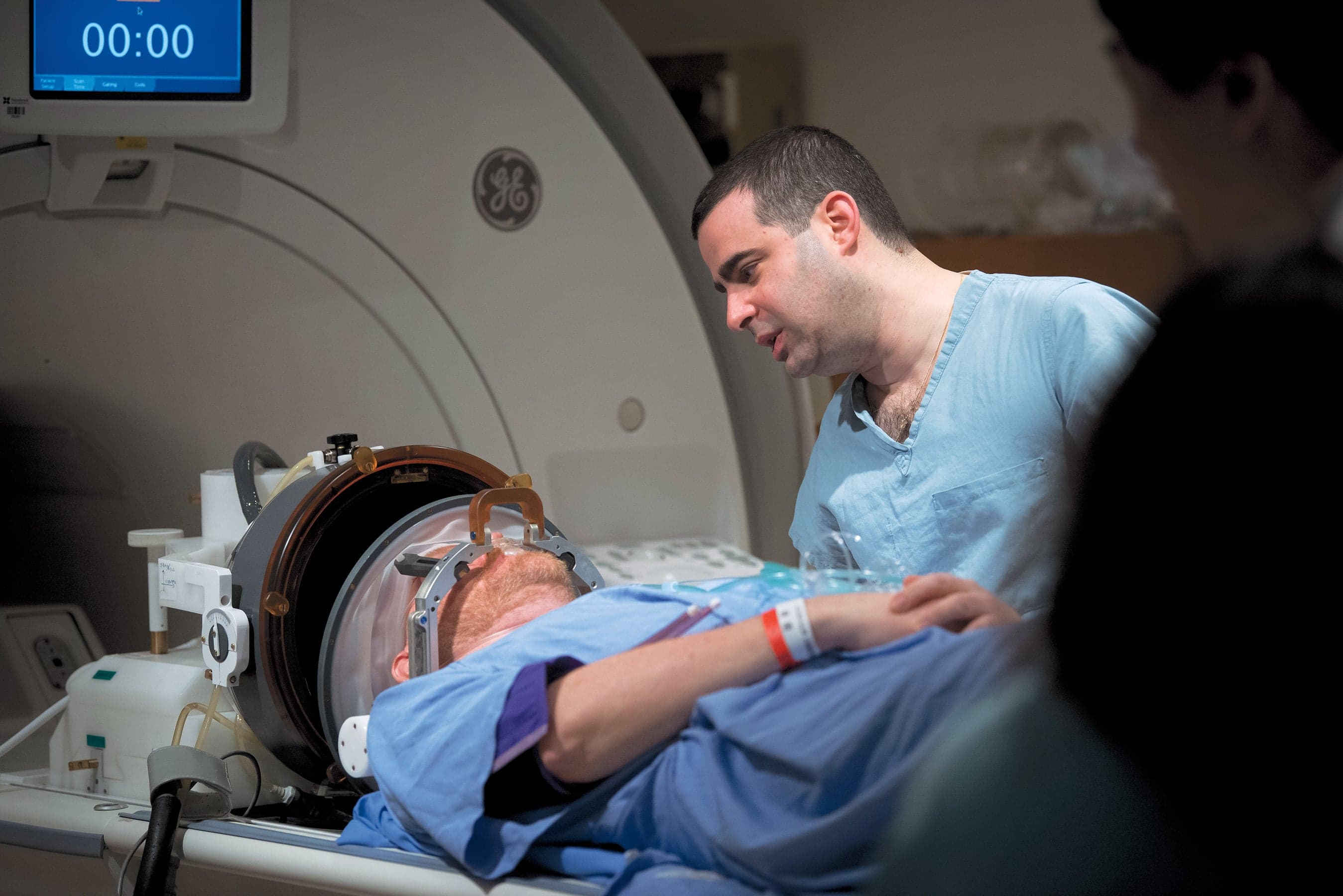 Hudspith (left) receives focused ultrasound treatment at Sunnybrook to treat a brain tumour (Courtesy of Sunnybrook Health Sciences Centre)