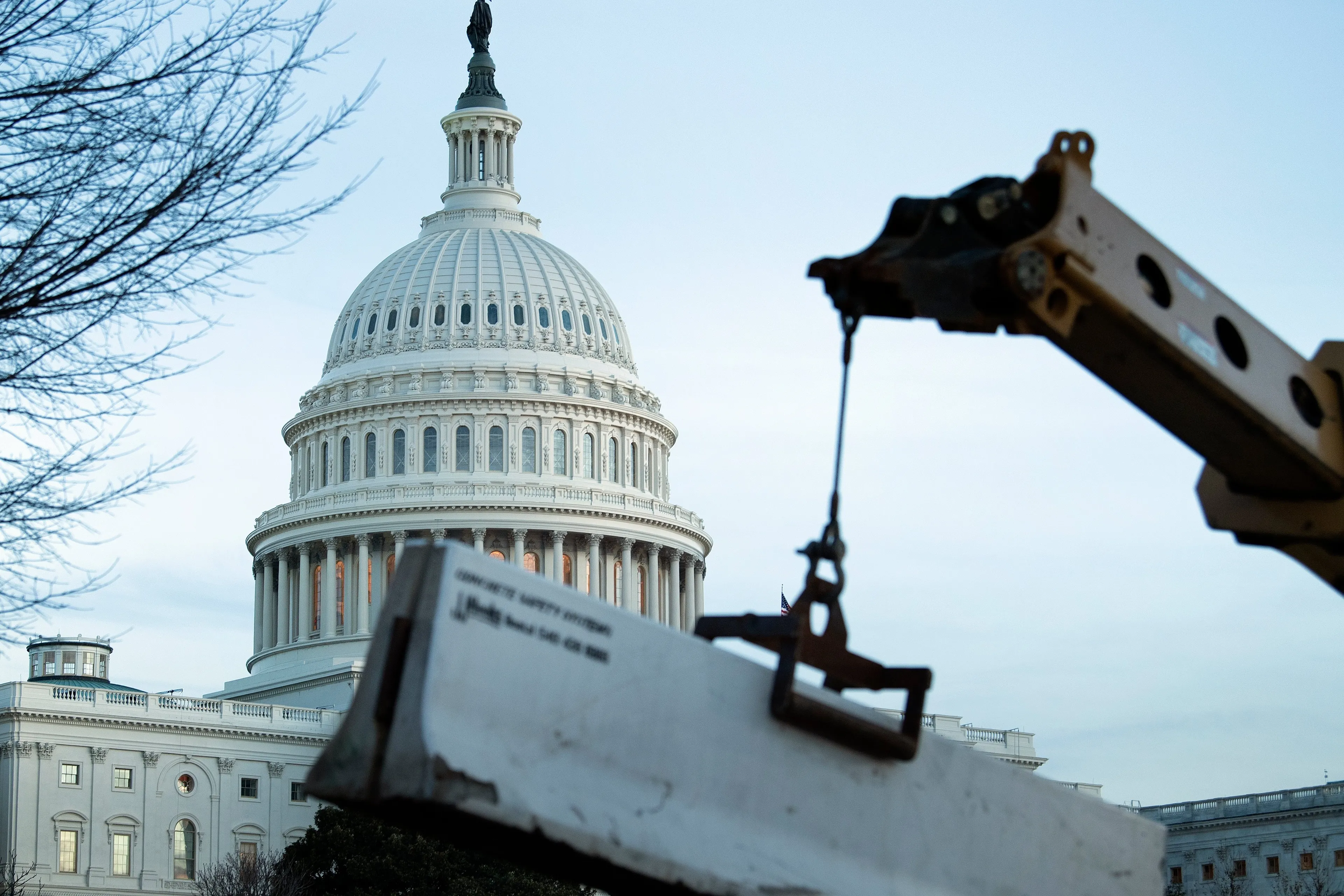 A crowd control fence around Capitol Hill is reenforced with concrete barriers on Jan. 7, 2021, in Washington, DC (BRENDAN SMIALOWSKI/AFP via Getty Images)
