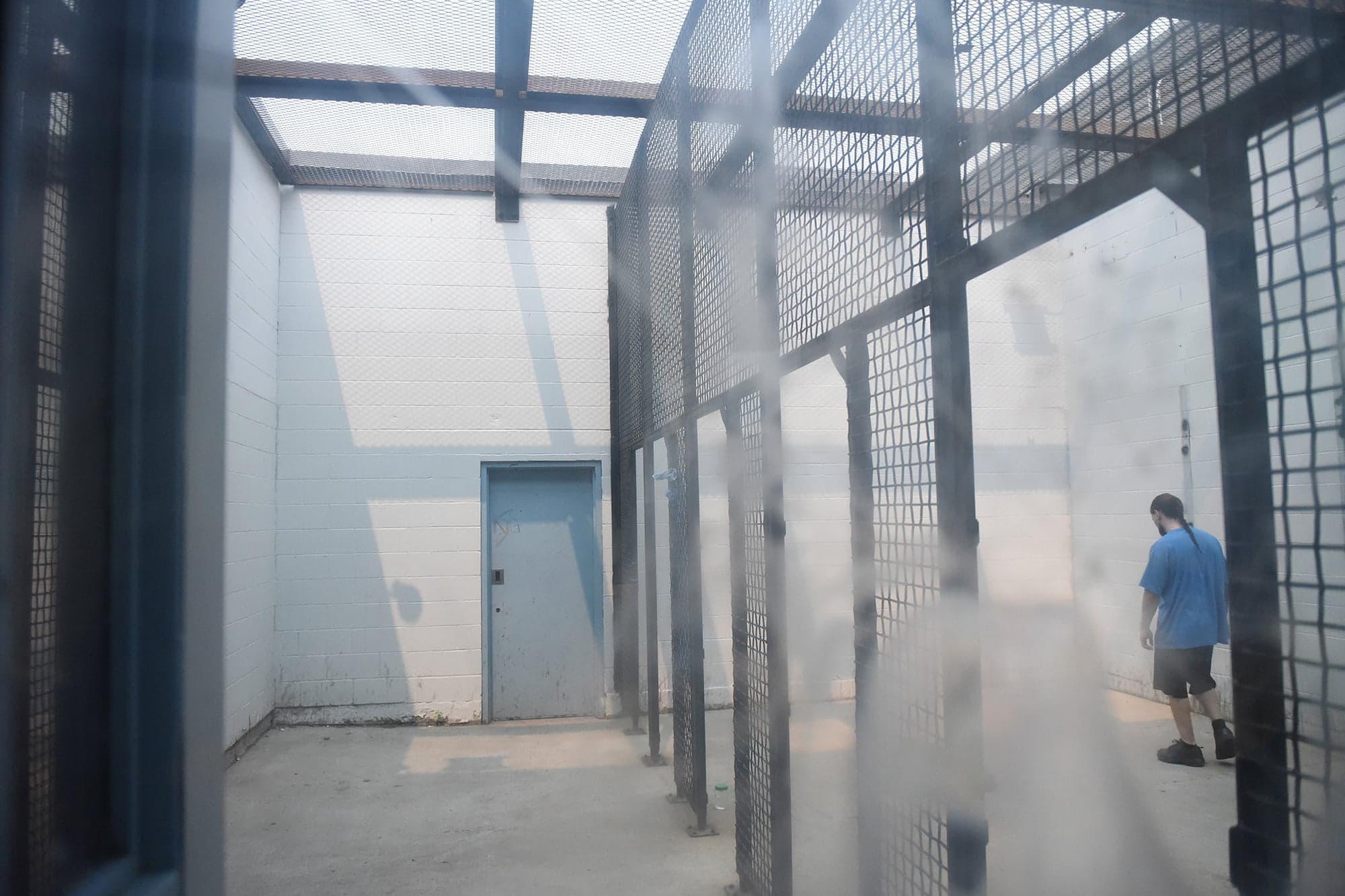 A prisoner paces in an outdoor recreation yard at Edmonton Institution (Courtesy of the Senate of Canada)