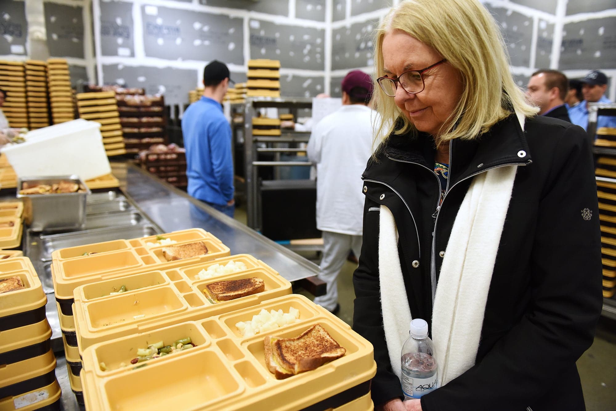 Members of the Senate Committee on Human Rights conducted a fact-finding mission to Canada’s Prairie penitentiaries and held a public hearing as part of their study on the human rights of federal prisoners. Pictured: Senator Cordy inspects a lunch offering: grilled cheese, salad and pears. Small portion size is a regular complaint at the prison, members of the prisoners’ committee told senators. (Courtesy of the Senate of Canada)