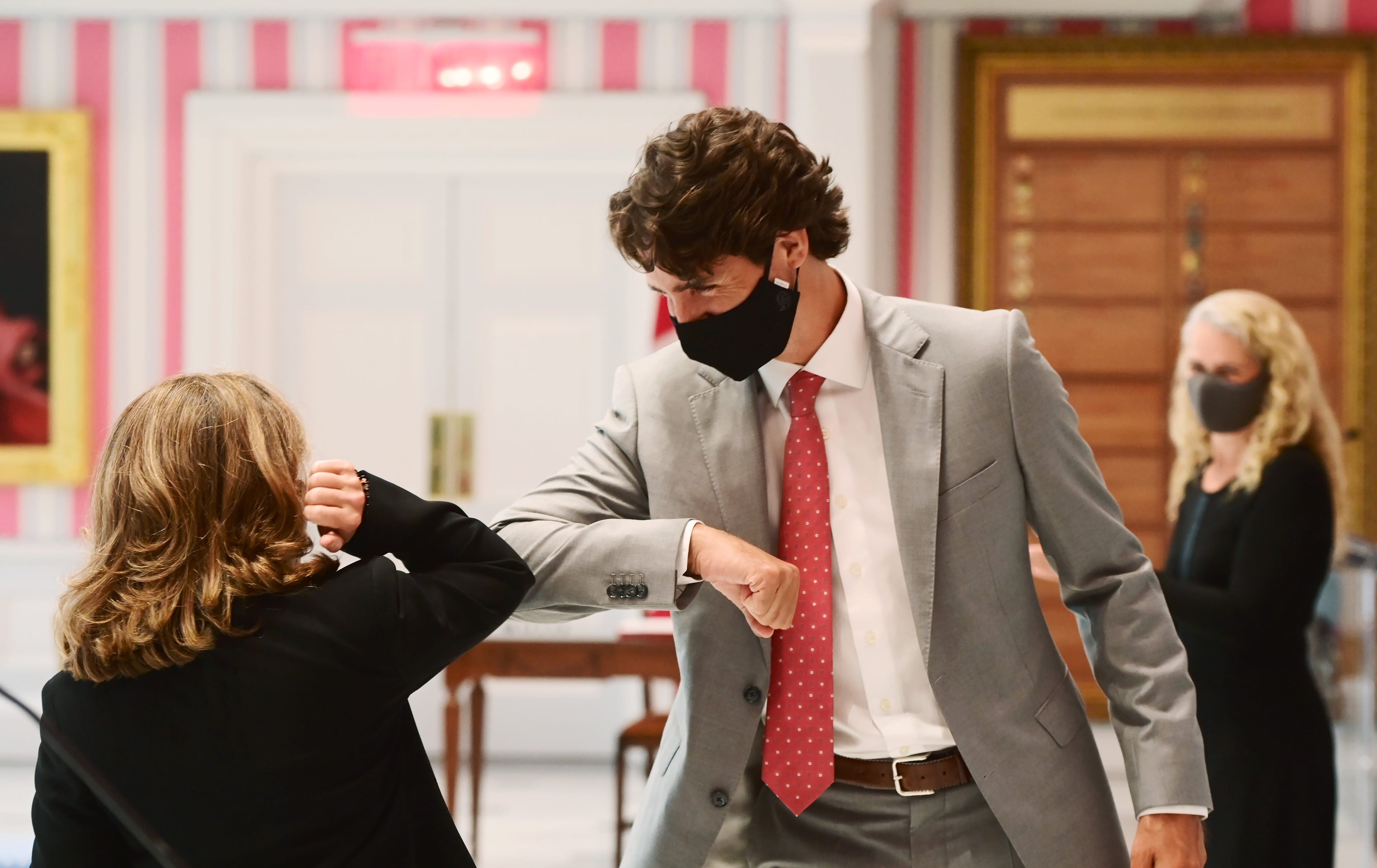 Freeland elbow bumps Trudeau after being sworn in as finance minister following a cabinet shuffle at Rideau Hall in Ottawa on Aug. 18, 2020 (CP/Sean Kilpatrick)