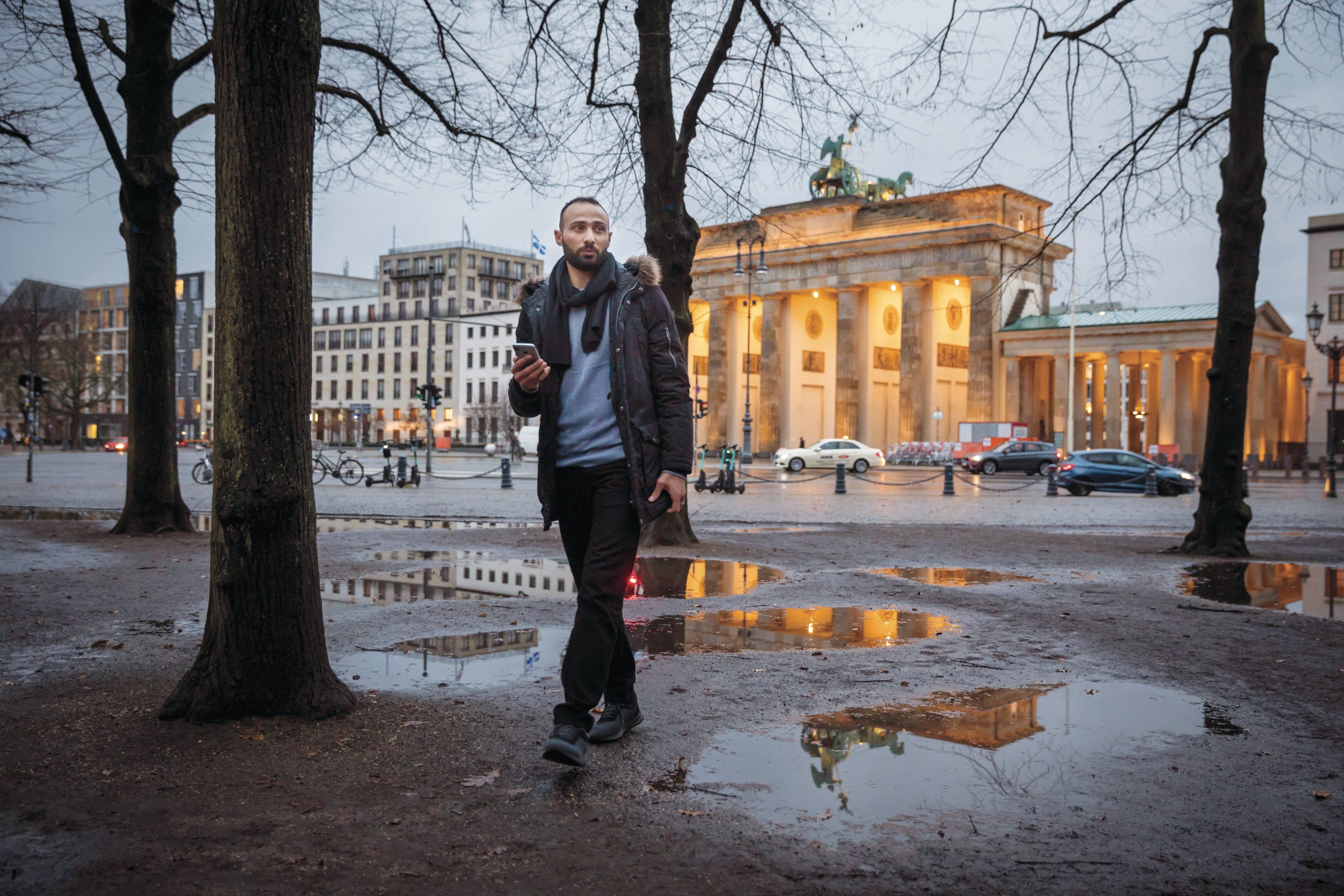 Ramadan Al Zaher in front of Brandenburg Gate. (Photograph by Gordon Welters)