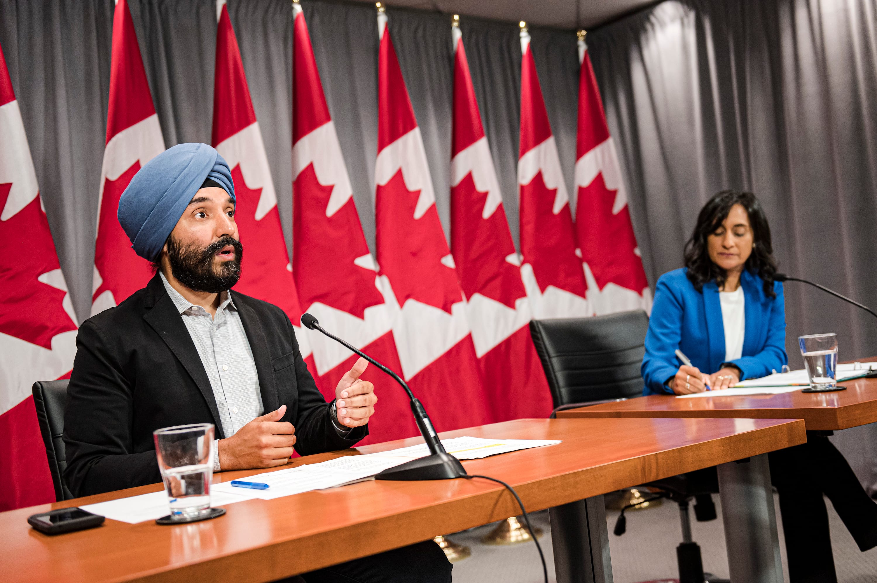 Navdeep Bains, Minister of Innovation, Science and Industry and Anita Anand, Minister of Public Services and Procurement make an announcement regarding vaccine procurement, in Toronto, on Wed., Aug., 5, 2020. (Christopher Katsarov/CP)