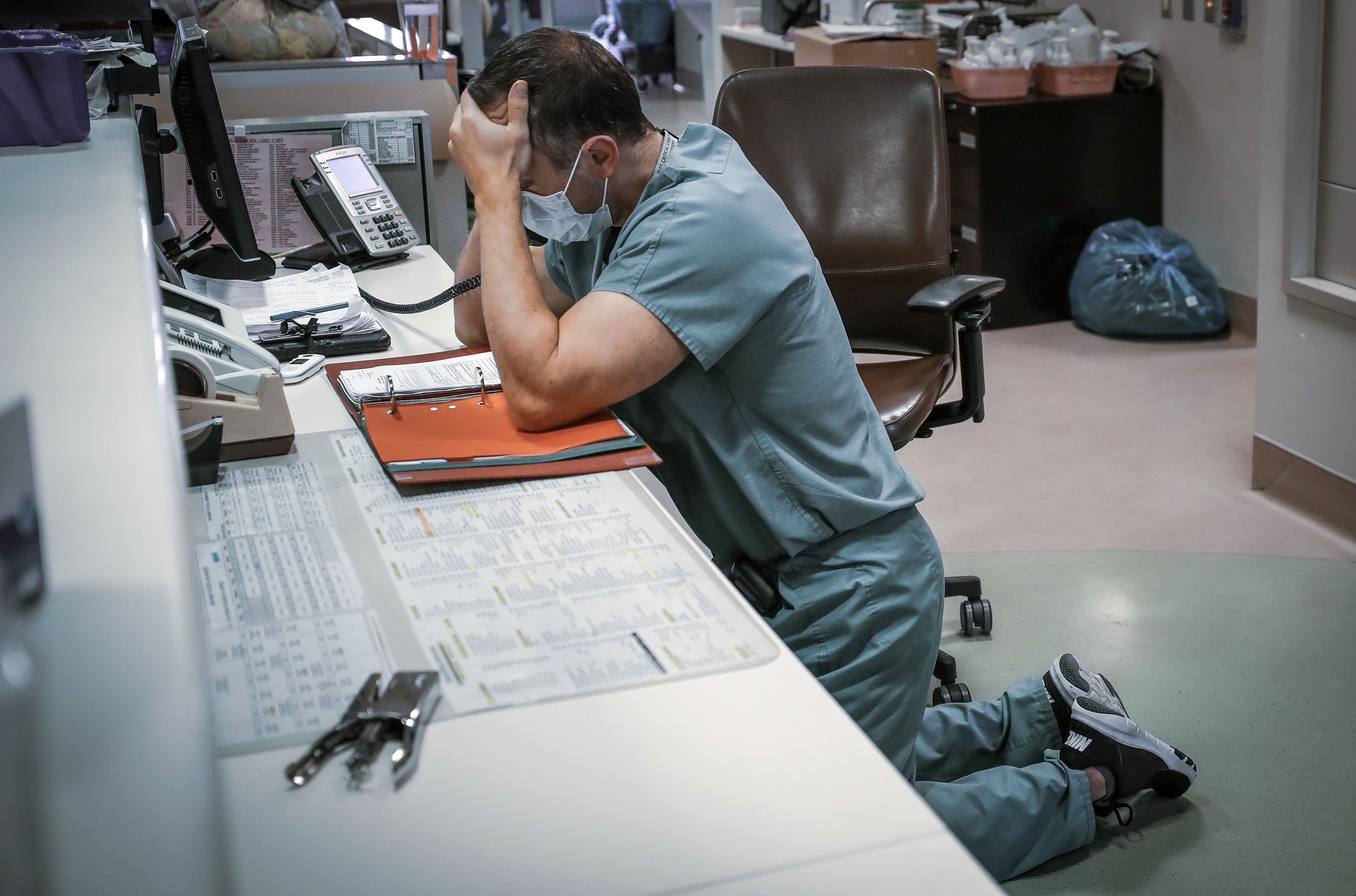Dr. Simon Demers-Marcil, an ICU physician in Calgary, calls a family to tell them a loved one has died of COVID-19 (Leah Hennel/AHS)