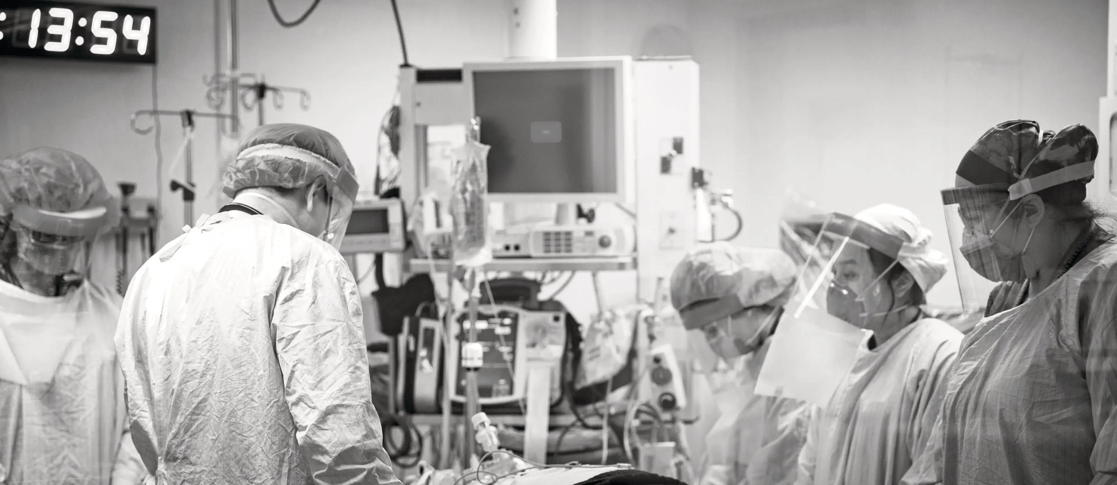 (L to R) Code Team Leader Dr. Layli Sanaee, Emergency physician Dr. Derrick Chang, respiratory therapist Mooska Mayel, and registered nurses Dalena Dang and Ashley Mitchell, pause in a moment of respect for the patient at the time of death. (Dawn Lim)
