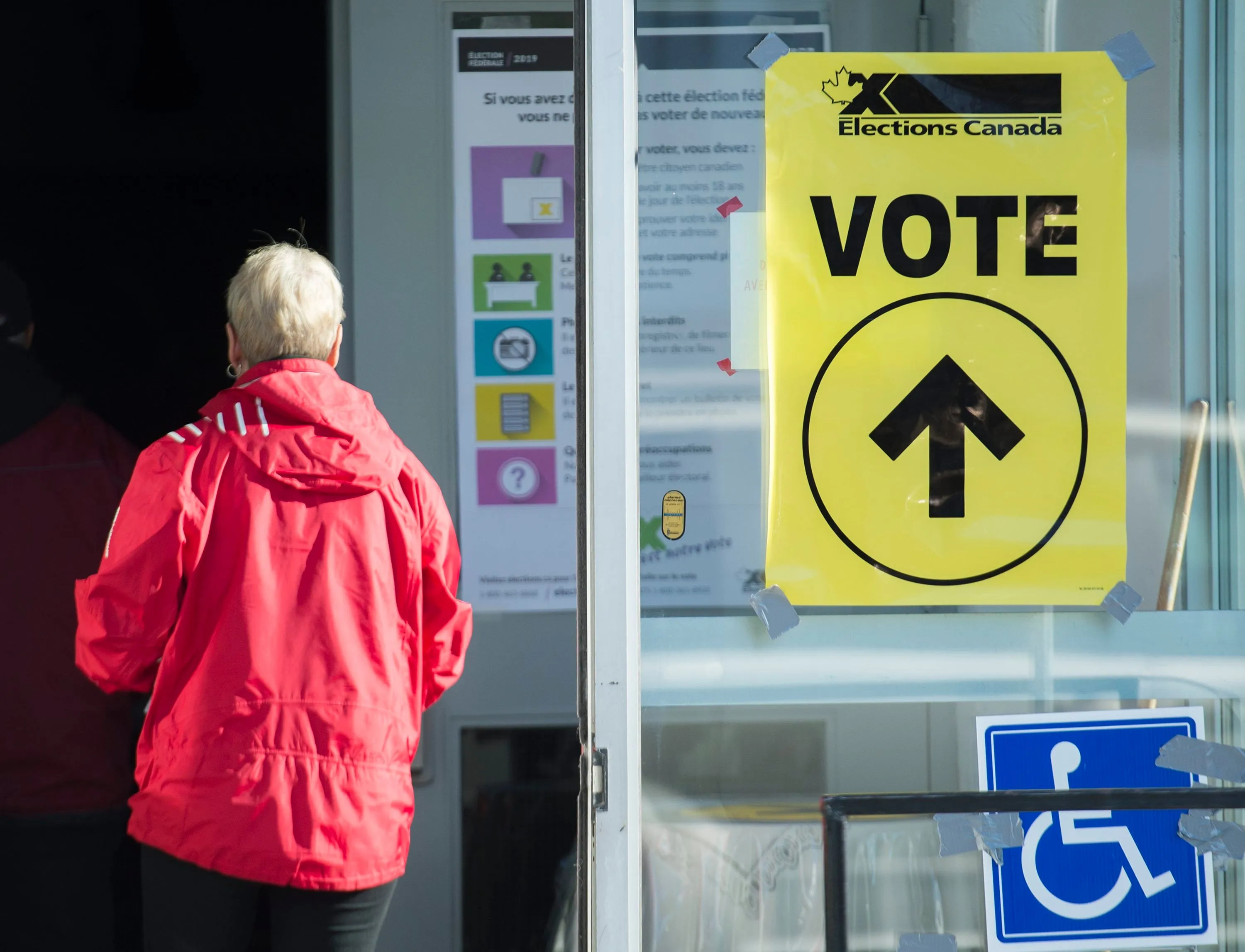 People arrive to cast their ballots at a polling station on federal election day in Shawinigan, Que., on Oct. 21, 2019 (CP/Graham Hughes)
