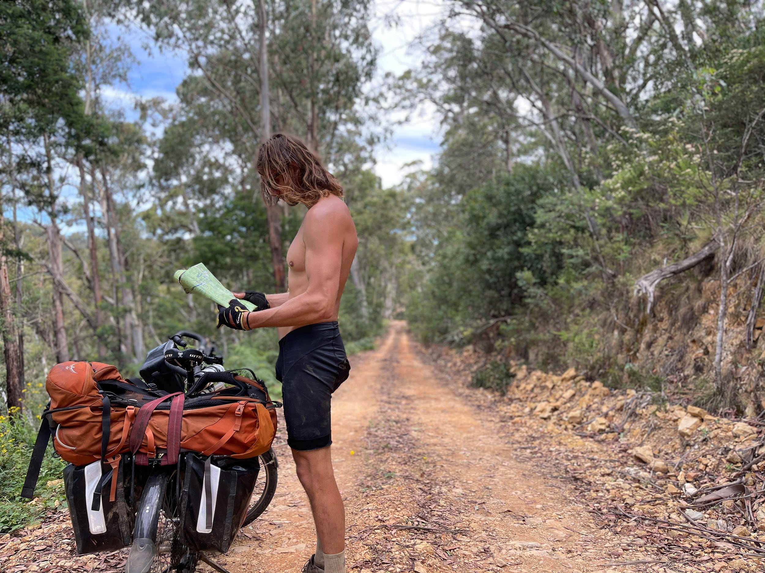 Keddy checks a map at a spot south of Mount Terrible (Layton Keddy)