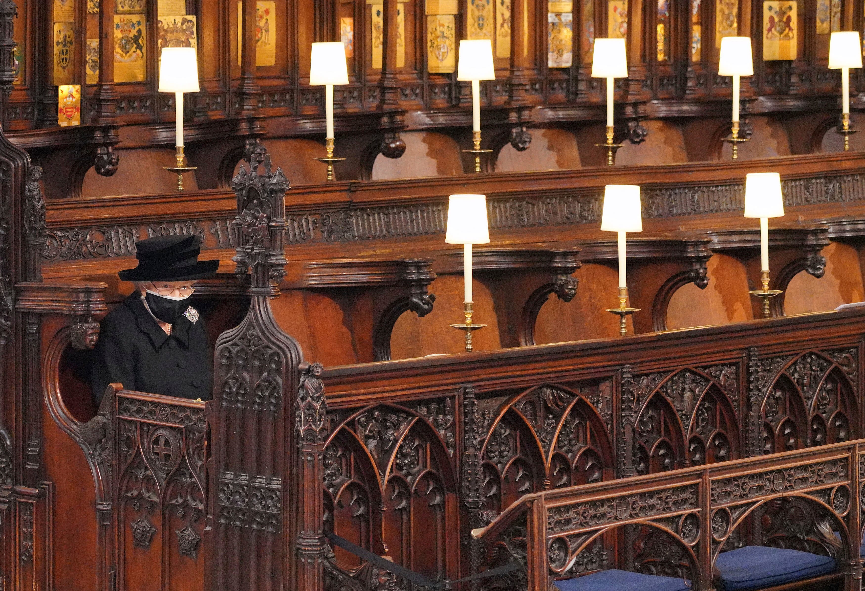 Britain's Queen Elizabeth II looks on as she sits alone in St. George’s Chapel during the funeral of Prince Philip, the man who had been by her side for 73 years, at Windsor Castle, Windsor, England, Saturday April 17, 2021. Prince Philip died April 9 at the age of 99 after 73 years of marriage to Britain's Queen Elizabeth II. (Jonathan Brady/Pool via AP)