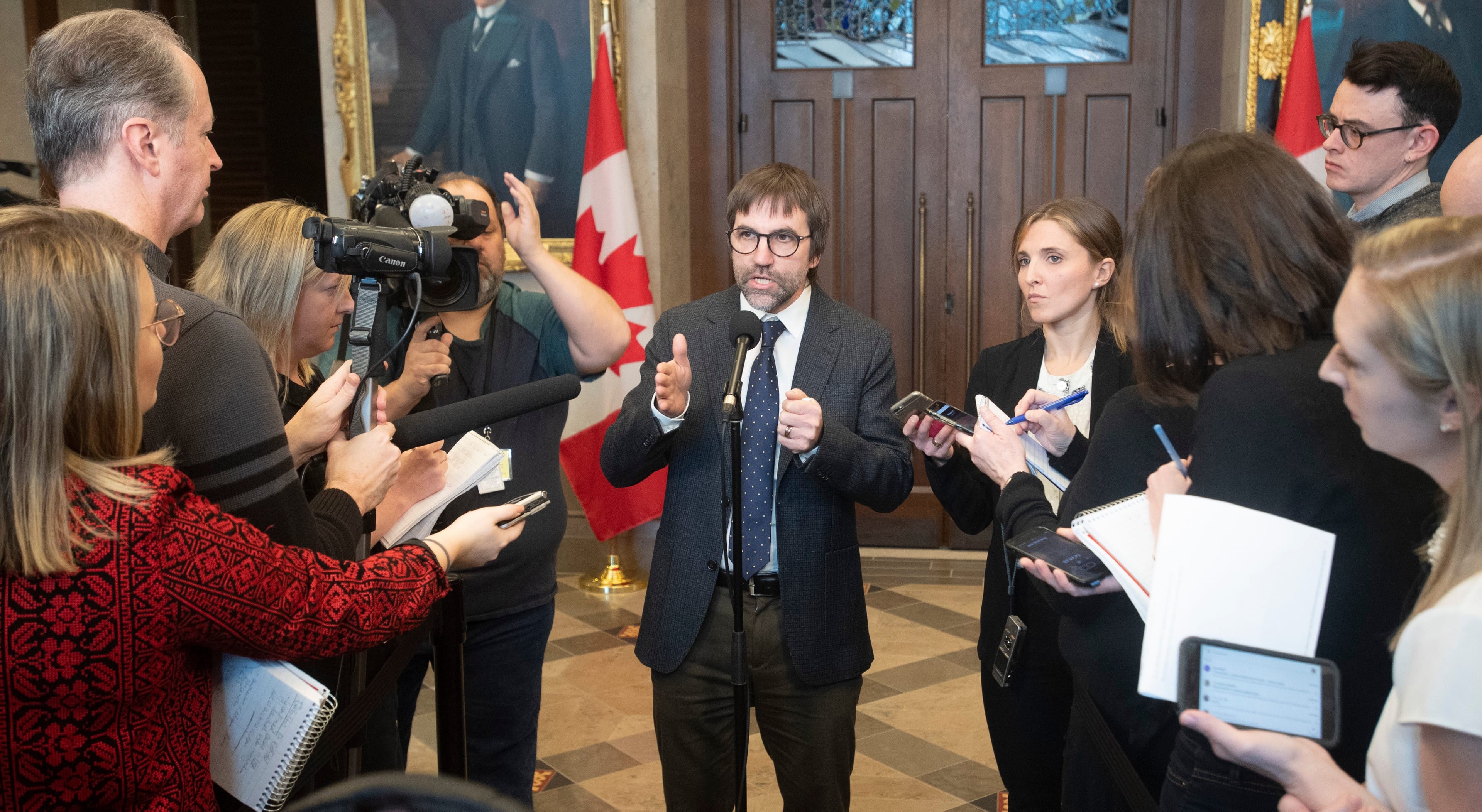 Guilbeault speaks with the media in the foyer of the House of Commons on Feb. 3, 2020 (CP/Adrian Wyld)