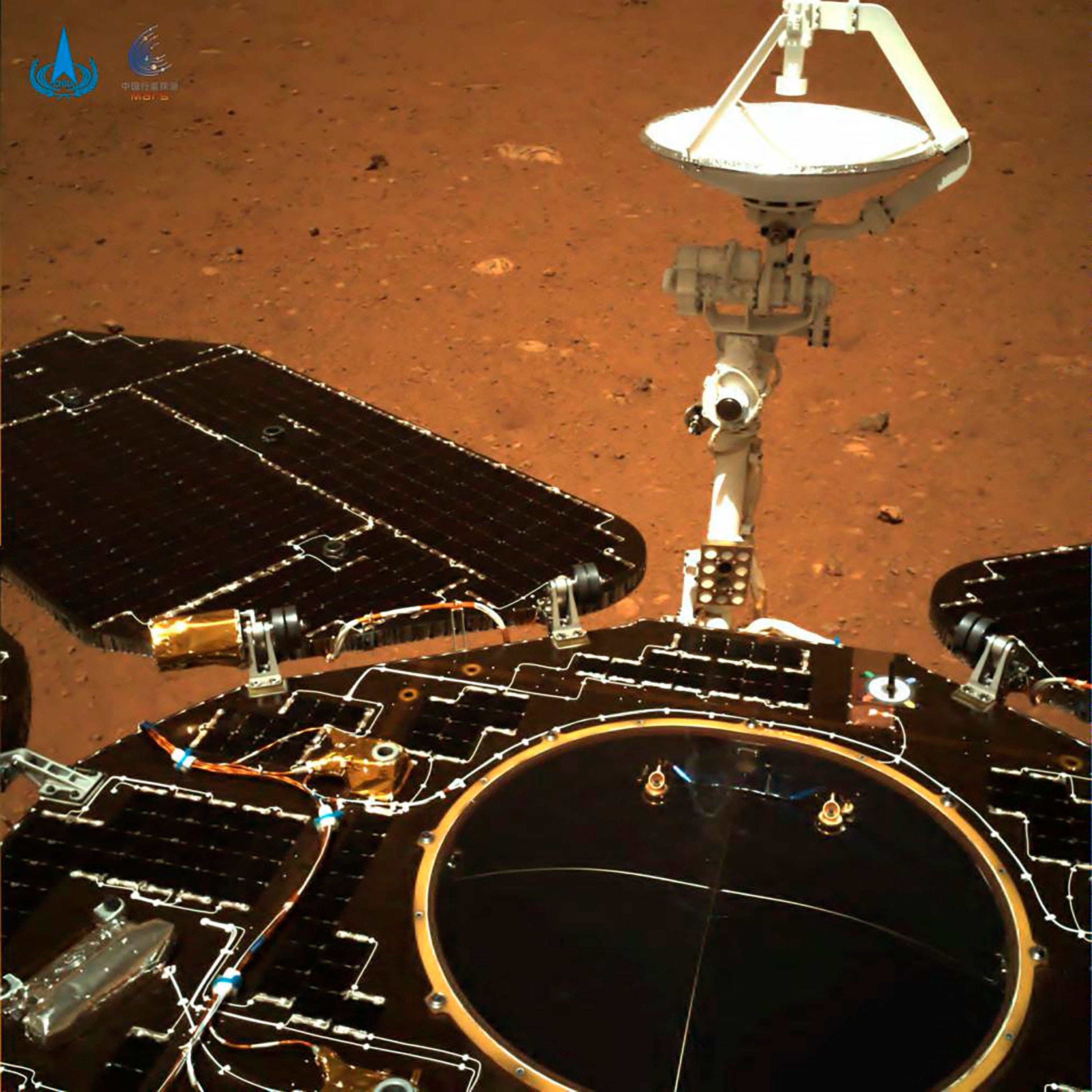 A photo taken by China's Zhurong Mars rover shows solar panels, antennae and the surface of the red planet. China landed a spacecraft on Mars for the first time on Saturday. (CNSA/AP/CP)