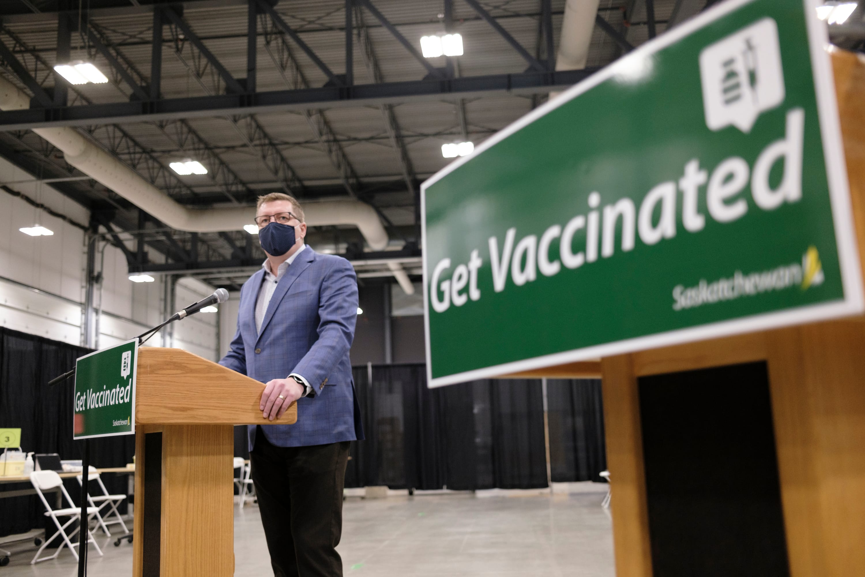 Scott Moe, the Saskatchewan premier, speaks to media in February after a tour of a COVID-19 mass immunization clinic. (Michael Bell/CP)