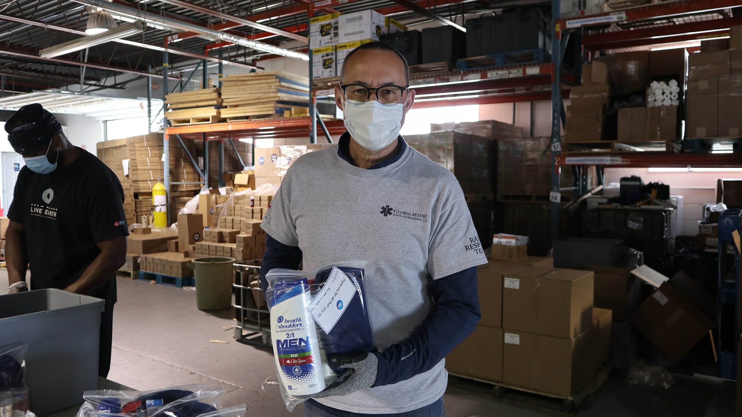 GlobalMedic volunteers assembling P&G hygiene kits for community donations. (Source: GlobalMedic)