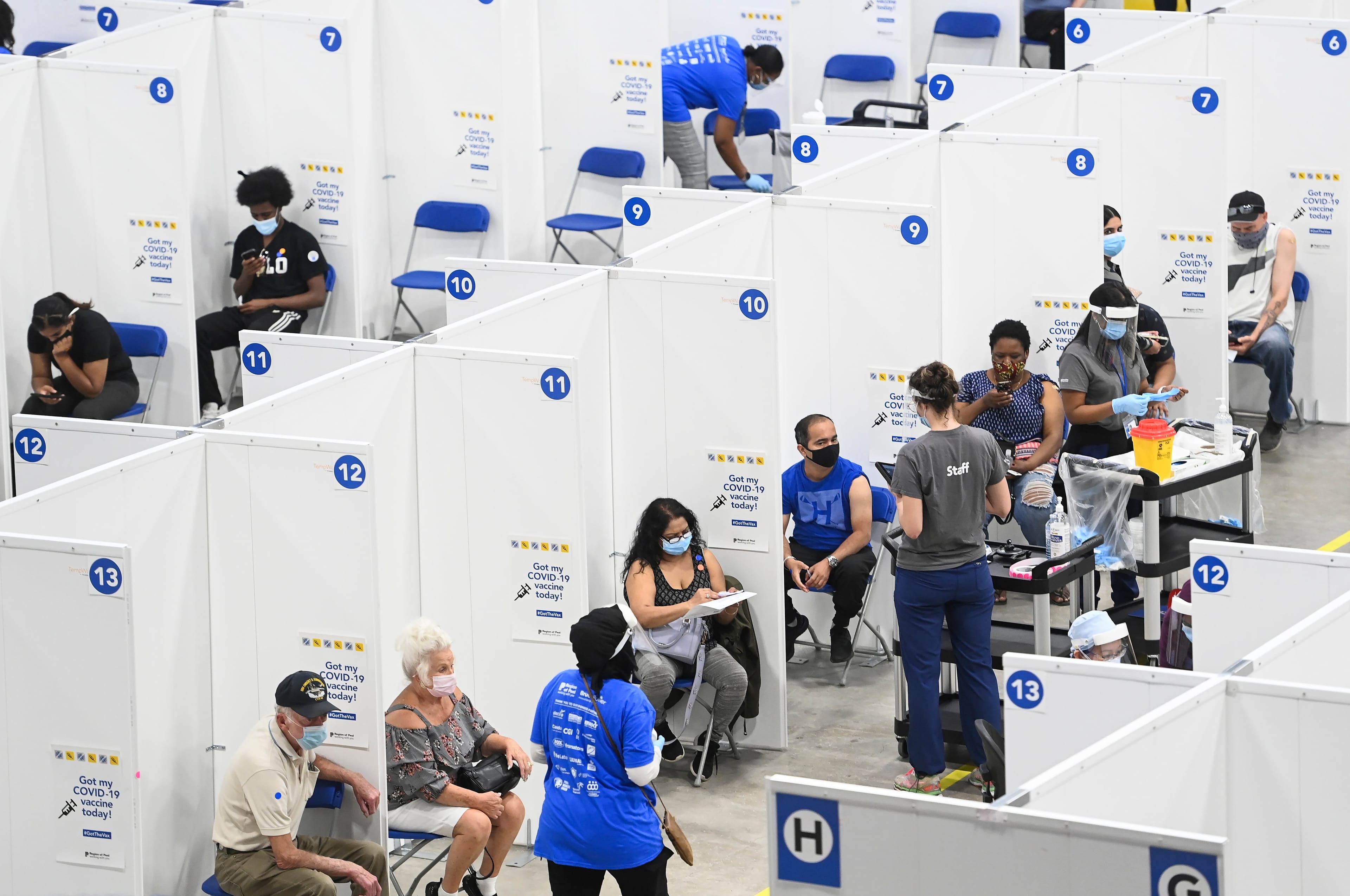 Vaccinations at the CAA Centre in Brampton, Ont. When the numbers are in, Shaffer and Tombe will chart them in ways we can all understand. (Nathan Denette/CP)
